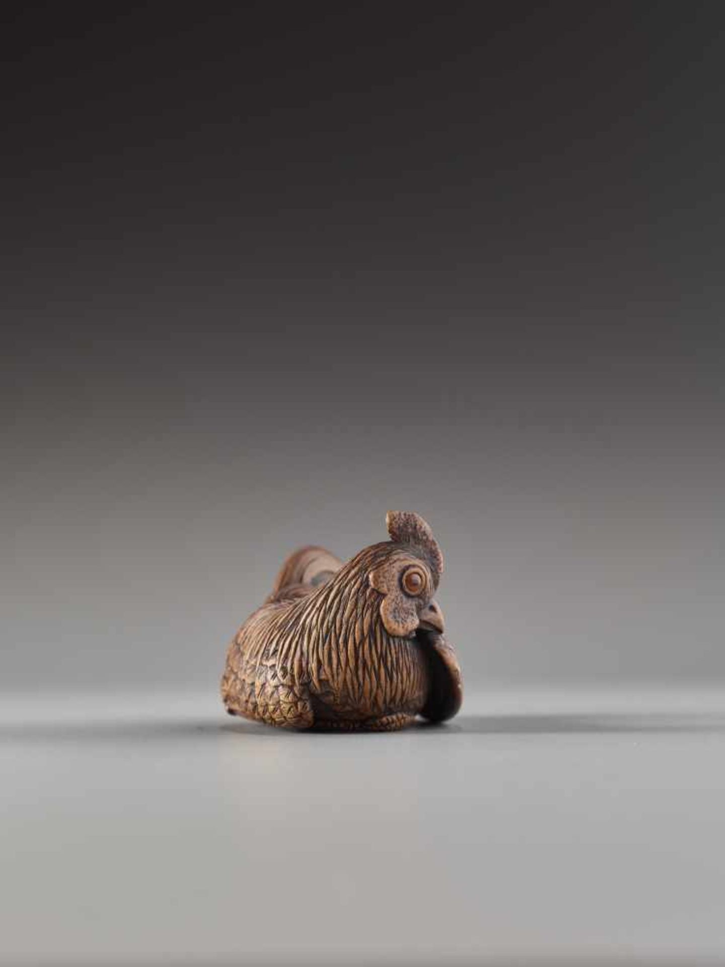 A FINE AND SMALL WOOD NETSUKE OF A RECUMBENT COCKEREL BY HOKYUDO ITSUMINWood netsukeJapan, Edomid- - Image 6 of 10