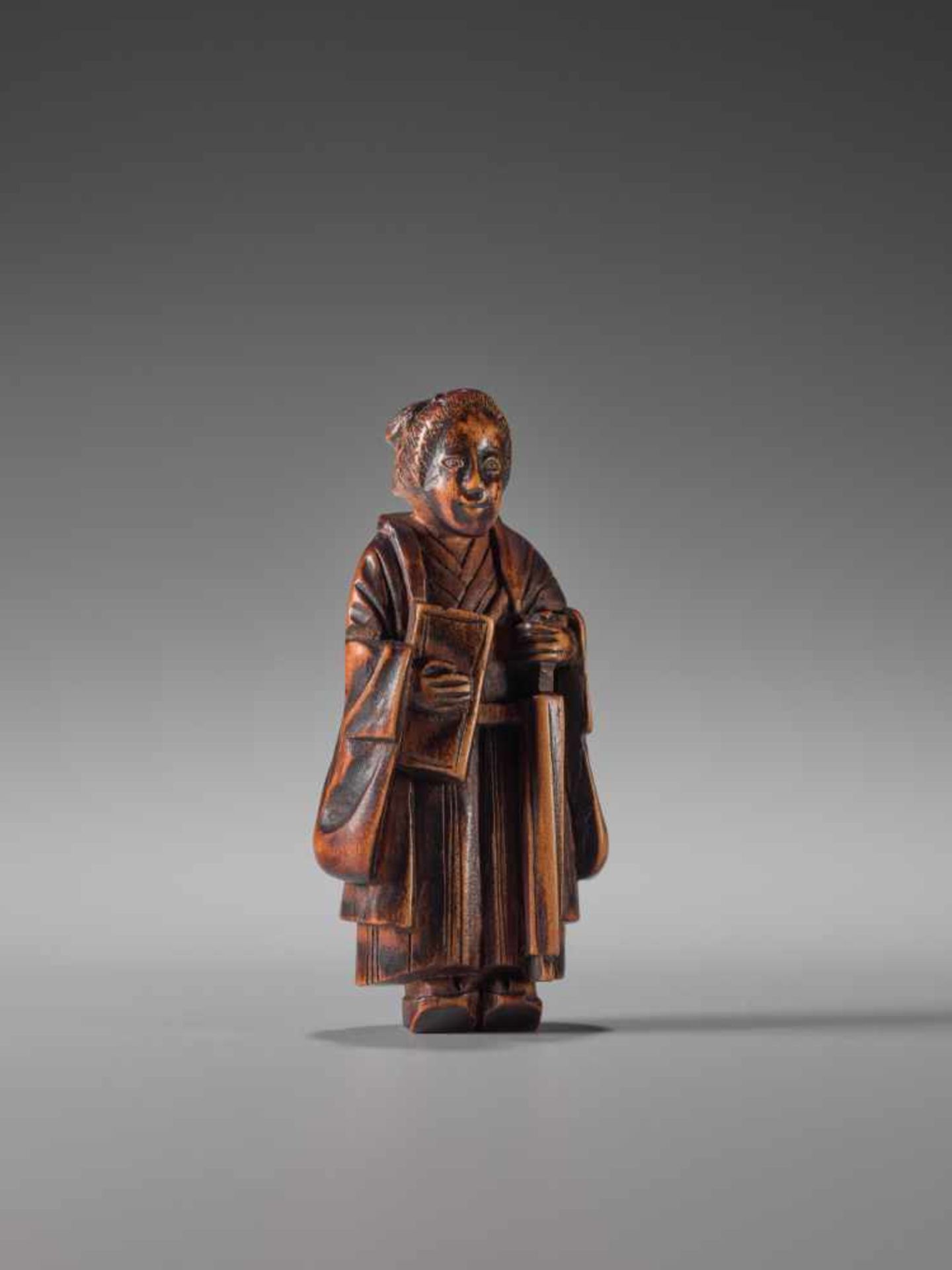 A WOOD NETSUKE OF A LADY WITH BOOK AND UMBRELLAWood netsukeJapan1st half of 19th century, Edo period - Image 2 of 6
