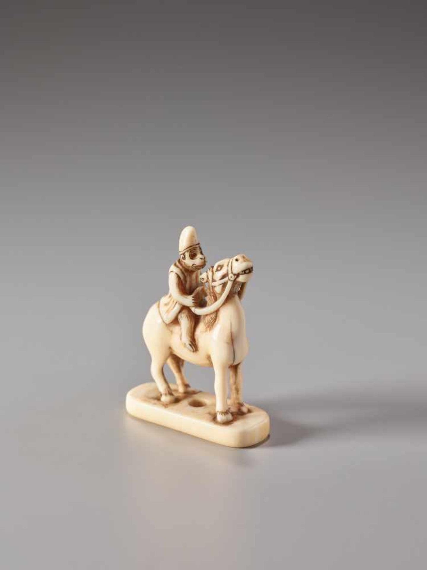 AN IVORY NETSUKE OF A MONKEY ON A HORSEIvory netsukeJapan19th century, Edo period (1615-1868)The - Image 5 of 6