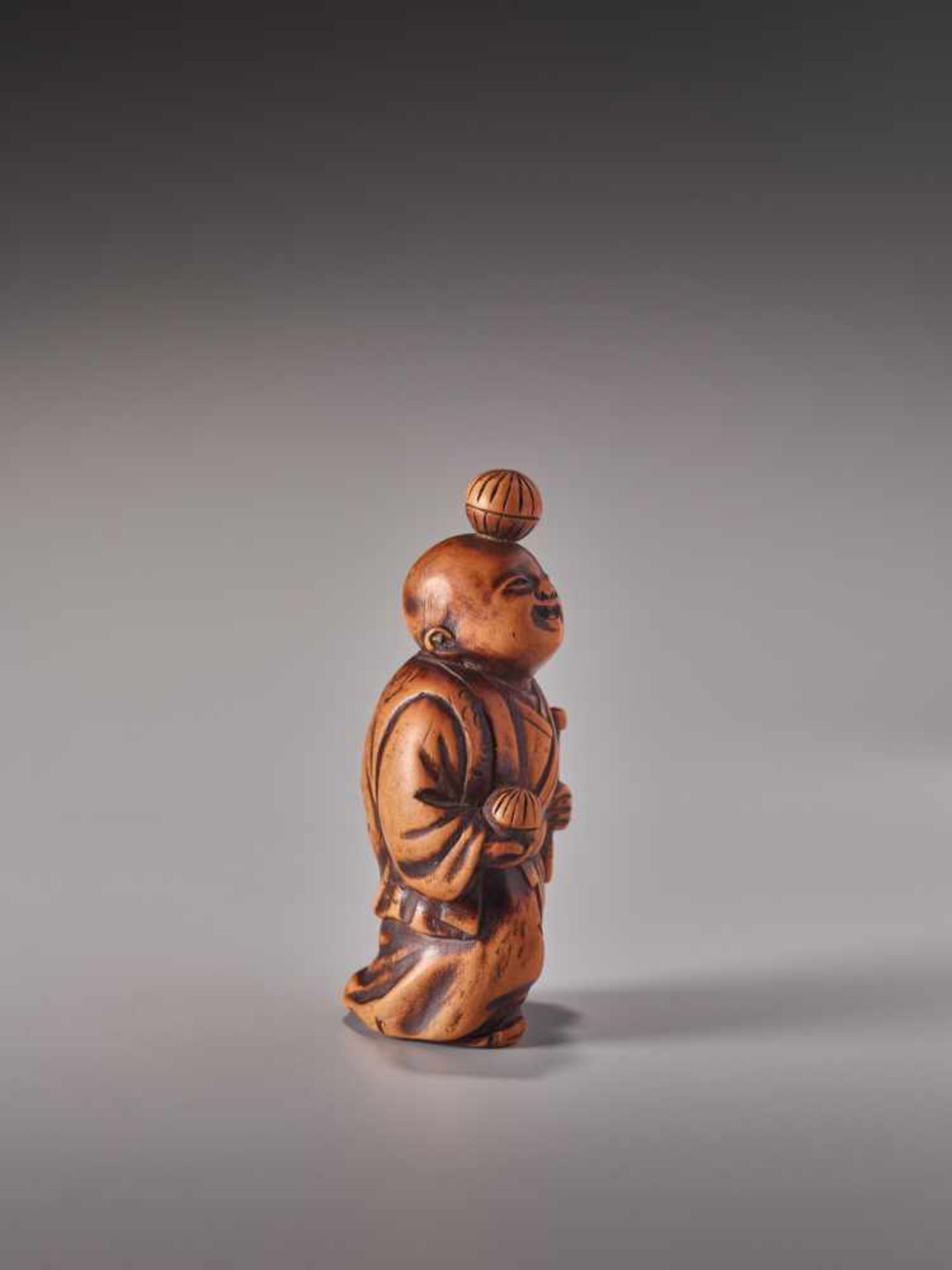 A WOOD NETSUKE OF A JUGGLING BOYWood netsukeJapan19th century, Edo period (1615-1868)This karako - Image 3 of 5