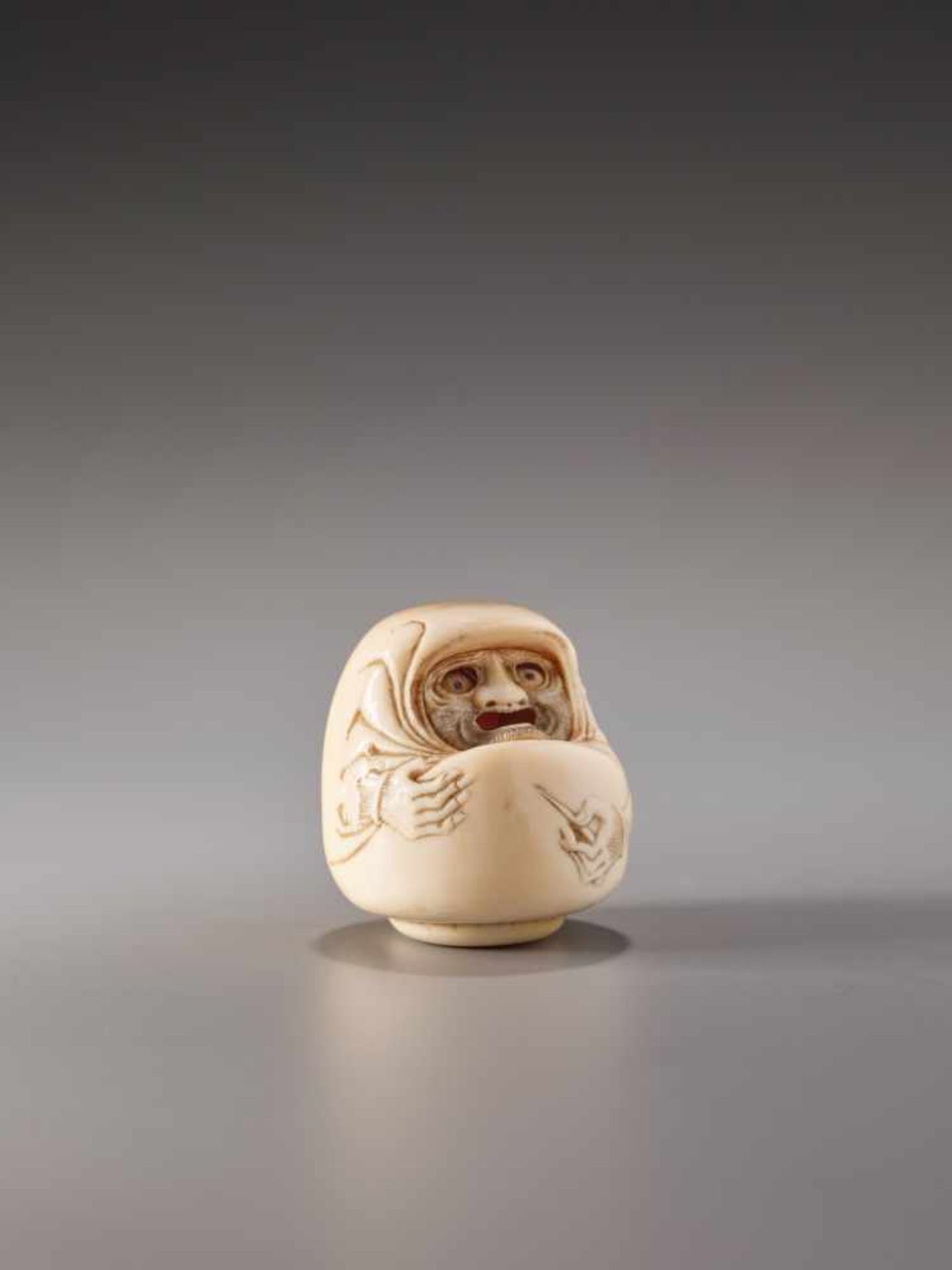 A RARE IVORY KARAKURI (TRICK) NETSUKE OF DARUMA DOLL BY SENKOKU (?)Ivory netsukeJapan19th century,