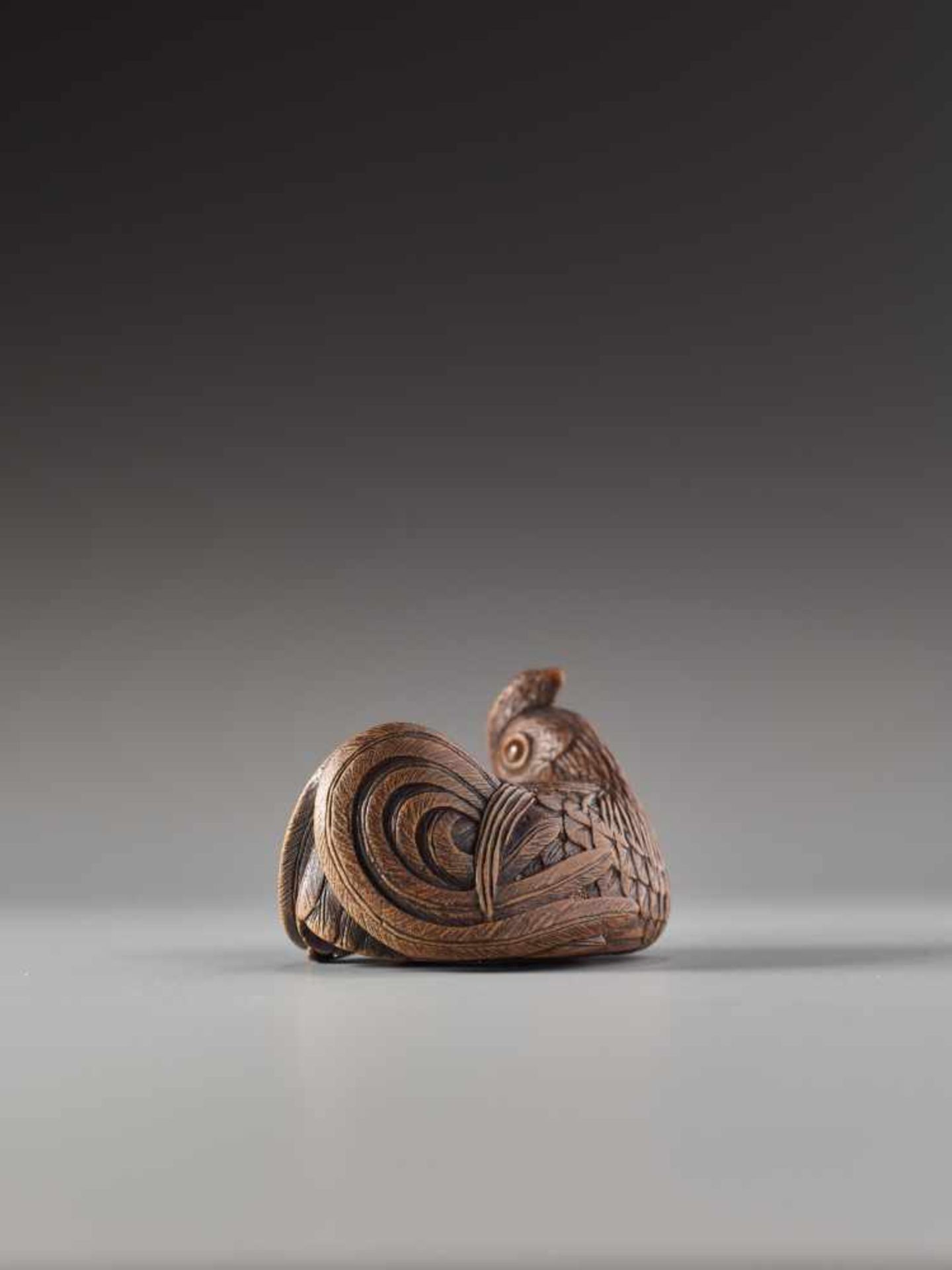 A FINE AND SMALL WOOD NETSUKE OF A RECUMBENT COCKEREL BY HOKYUDO ITSUMINWood netsukeJapan, Edomid- - Image 5 of 10