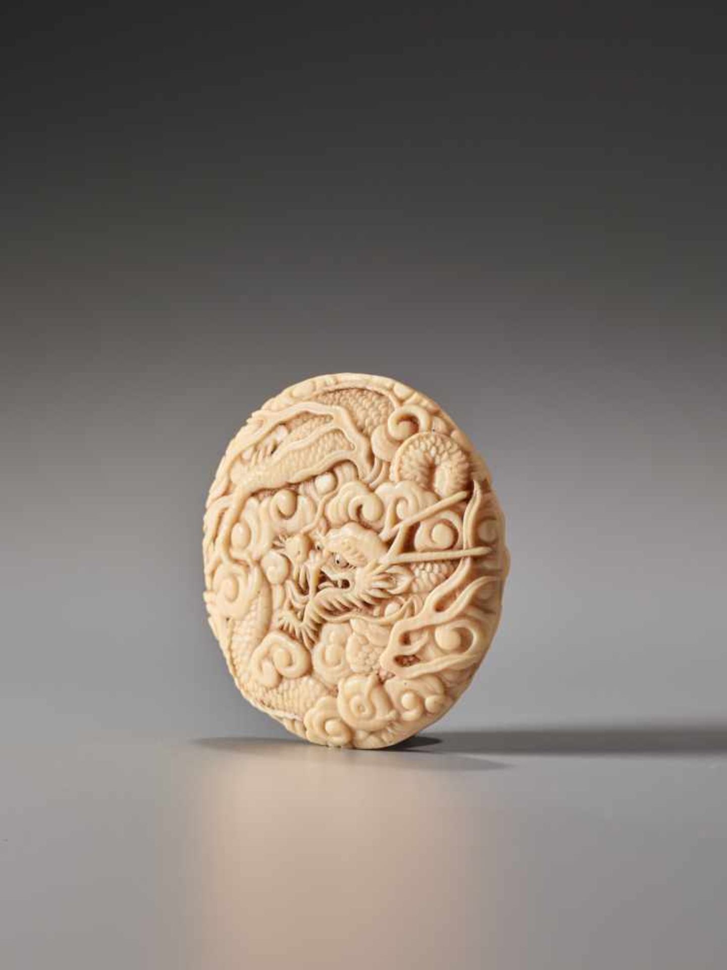 A FINE IVORY MANJU NETSUKE OF A SKY DRAGON ATTRIBUTED TO OKUTAKAIvory manju netsukeJapan19th - Image 3 of 5