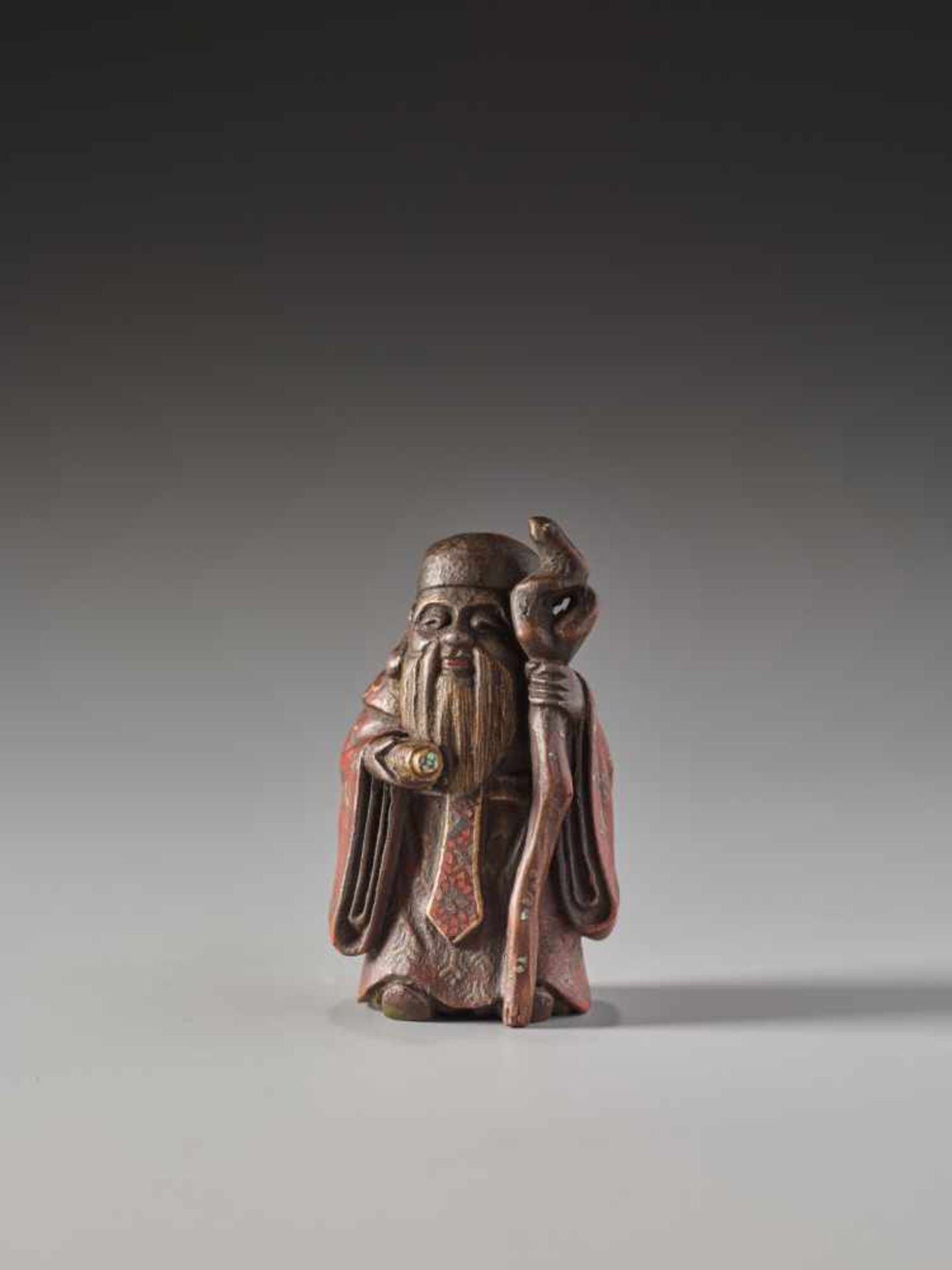 A SMALL LACQUERED WOOD NETSUKE OF JUROJINLacquered wood netsuke with mother-of-pearl inlaysJapanlate - Image 2 of 5