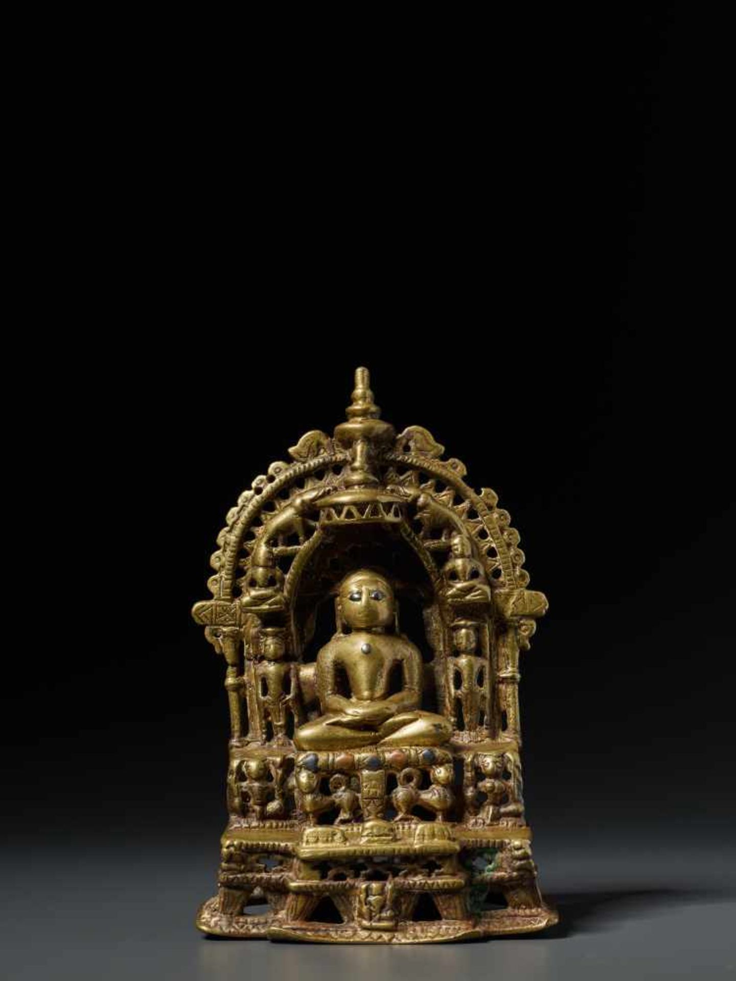 A SILVER AND COPPER INLAID JAIN BRASS SHRINE WITH MAHAVIRA, 15th – 16th CENTURY Brass with copper - Image 2 of 8