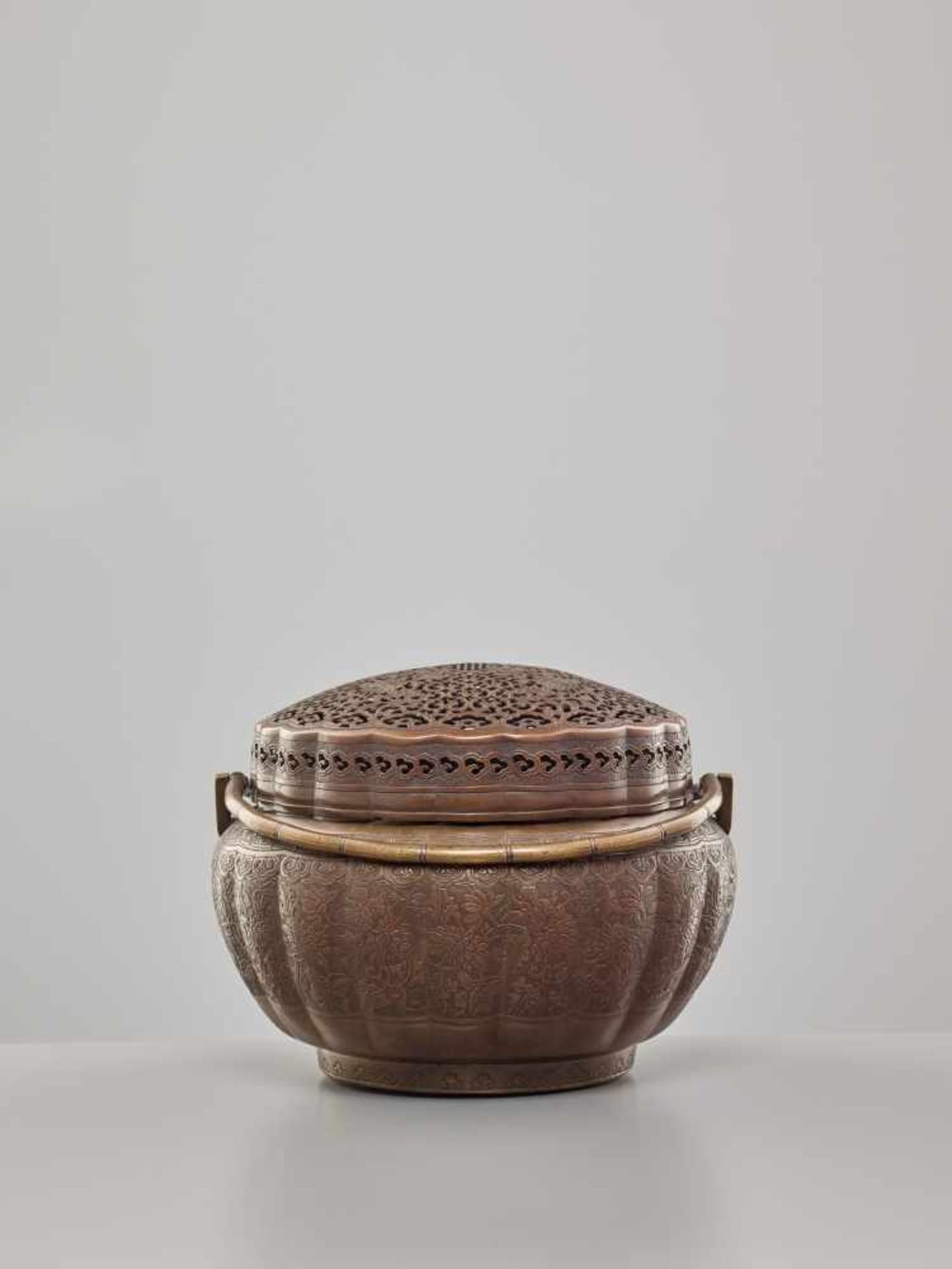 A COPPER HAND-WARMER WITH RETICULATED COVER, QING DYNASTYThe metal with an even reddish-brown - Image 8 of 15