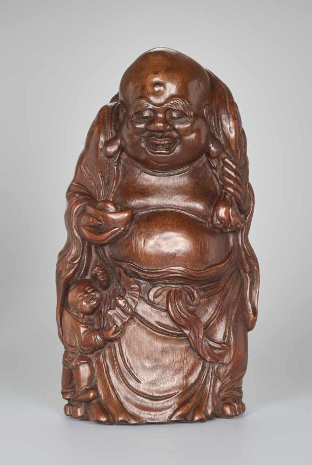 A VERY LARGE BAMBOO SHOOT CARVING OF BUDAI WITH INGOT, QING DYNASTYBamboo root China, Qing Dynasty