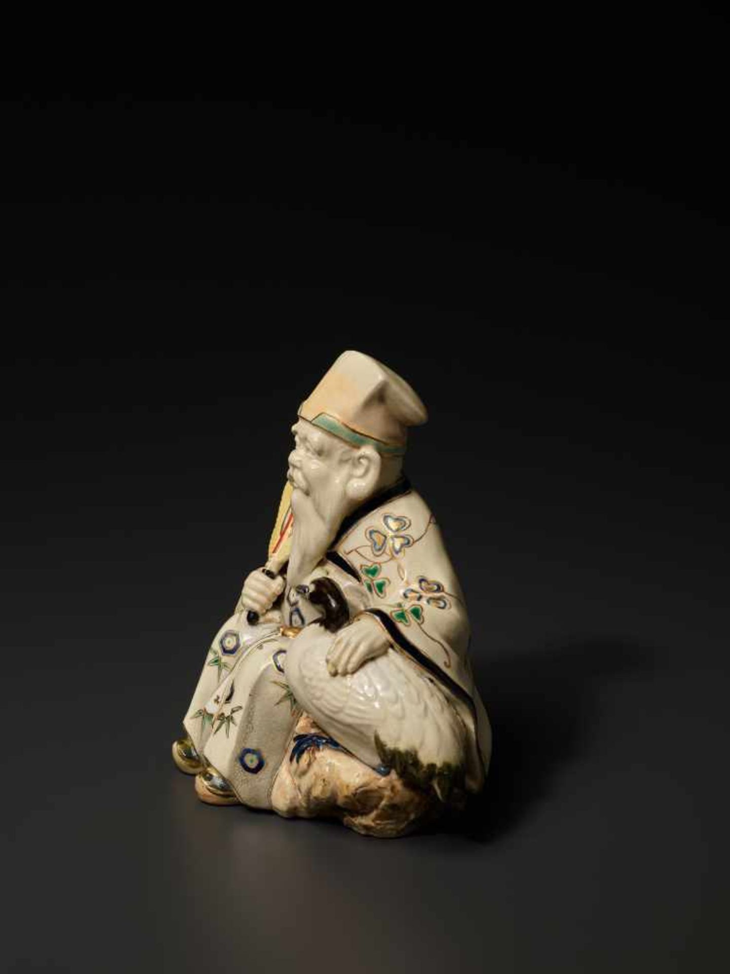 A SATSUMA OKIMONO FIGURE OF FUKUROKUJU WITH CRANESatsuma ceramicJapan, late 19th century, Meiji - Image 4 of 10