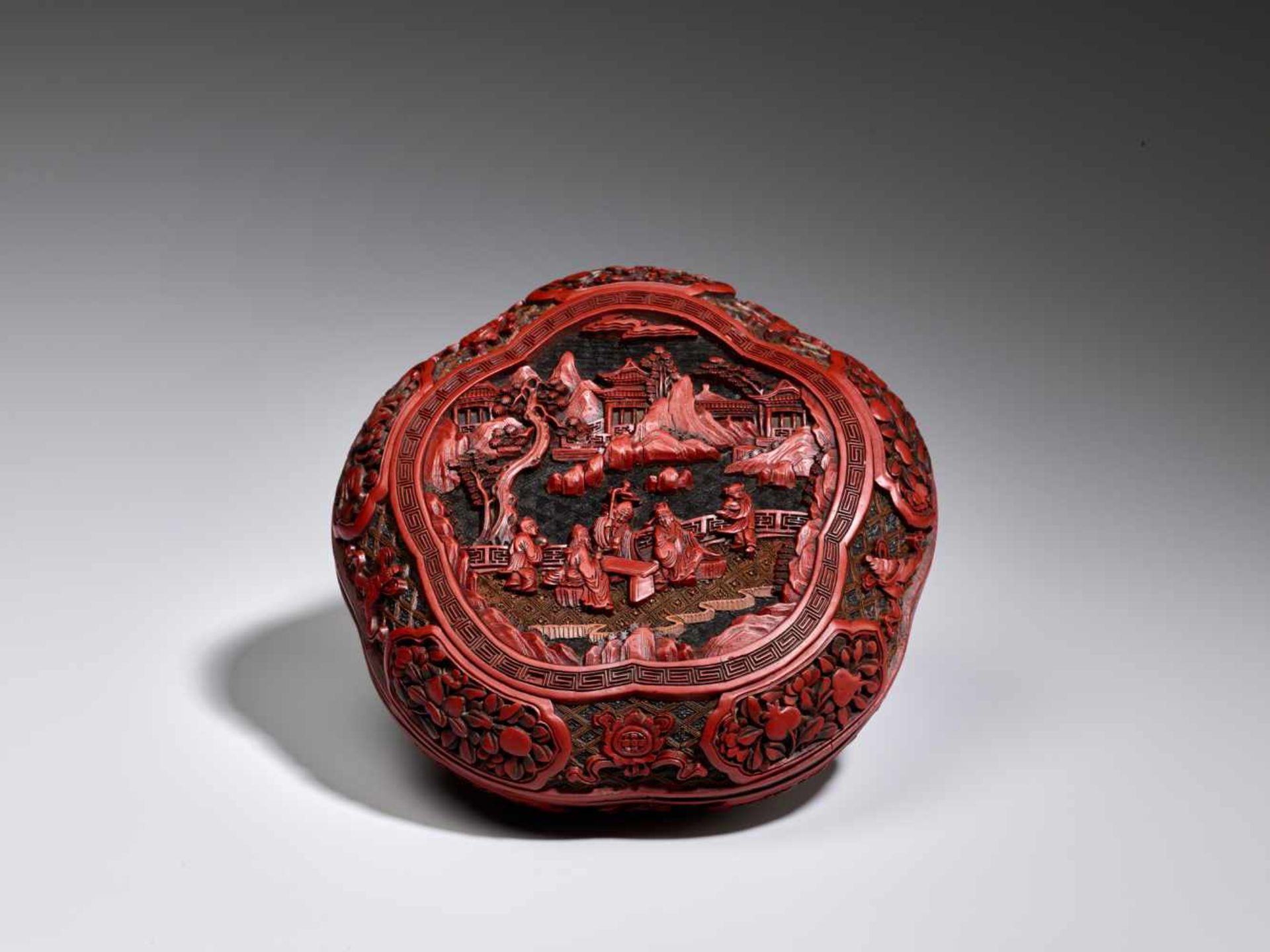 A VERY RARE CARVED THREE-COLOR LACQUER LOBED BOX AND COVER, QIANLONG Carved lacquer in high relief