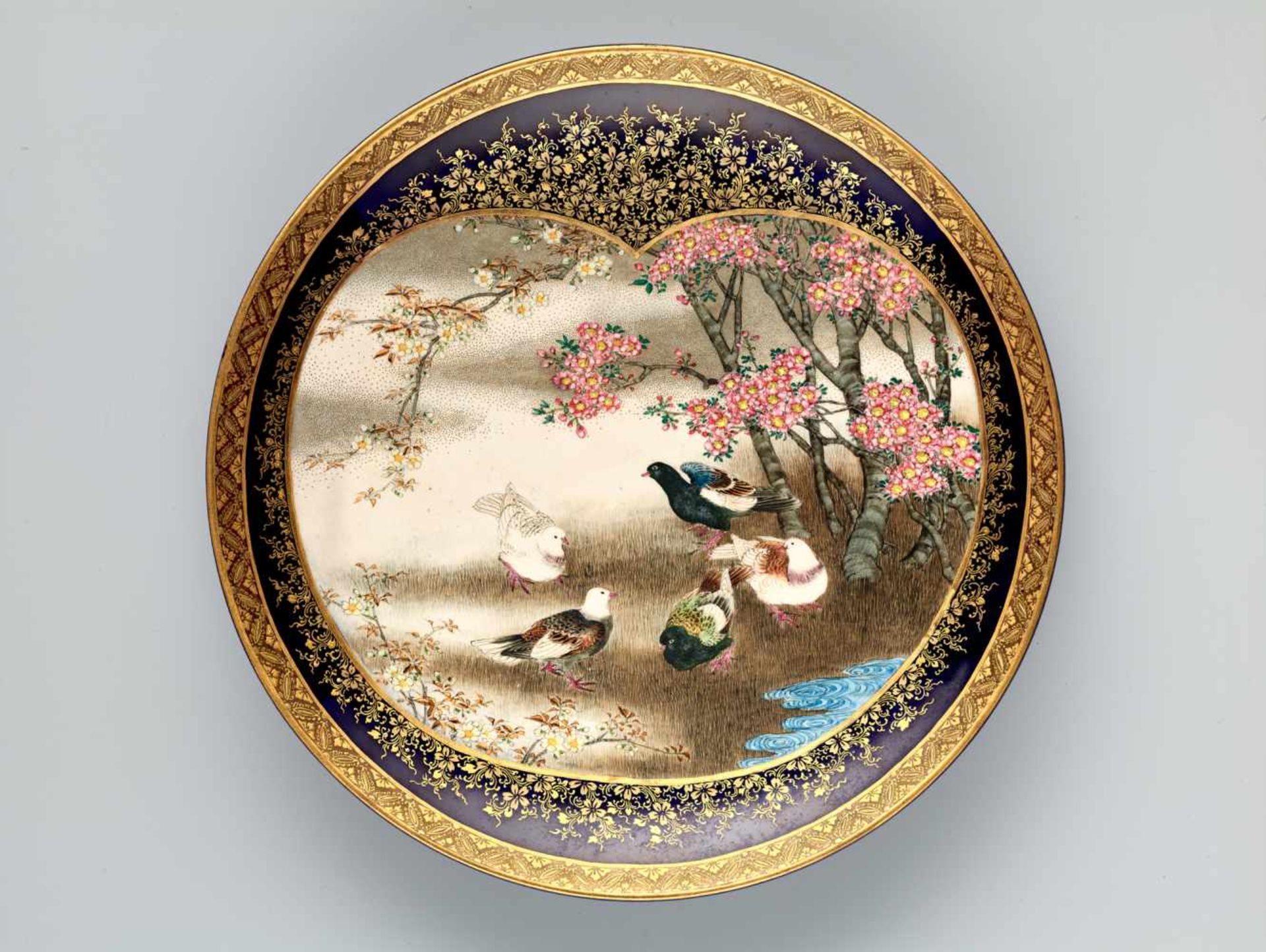 A MARVELLOUS SATSUMA PLATE BY KINKOZAN DEPICTING DOVES WITH CHERRY BLOSSOMSSatsuma ceramicJapan,