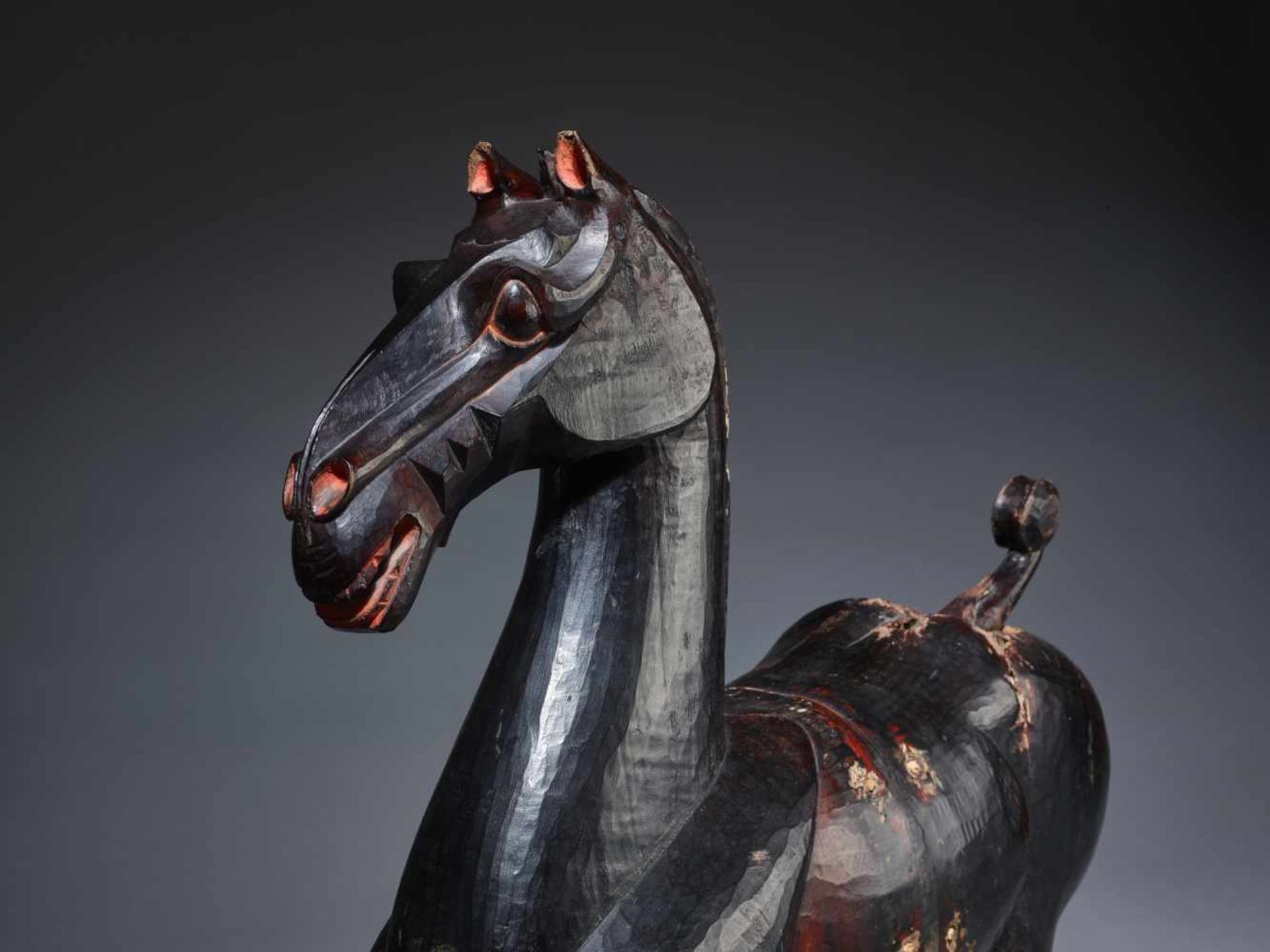 A LARGE AND MASSIVE LACQUERED WOOD STATUE OF A HORSE, SICHUAN, HAN DYNASTY Carved of two jointed