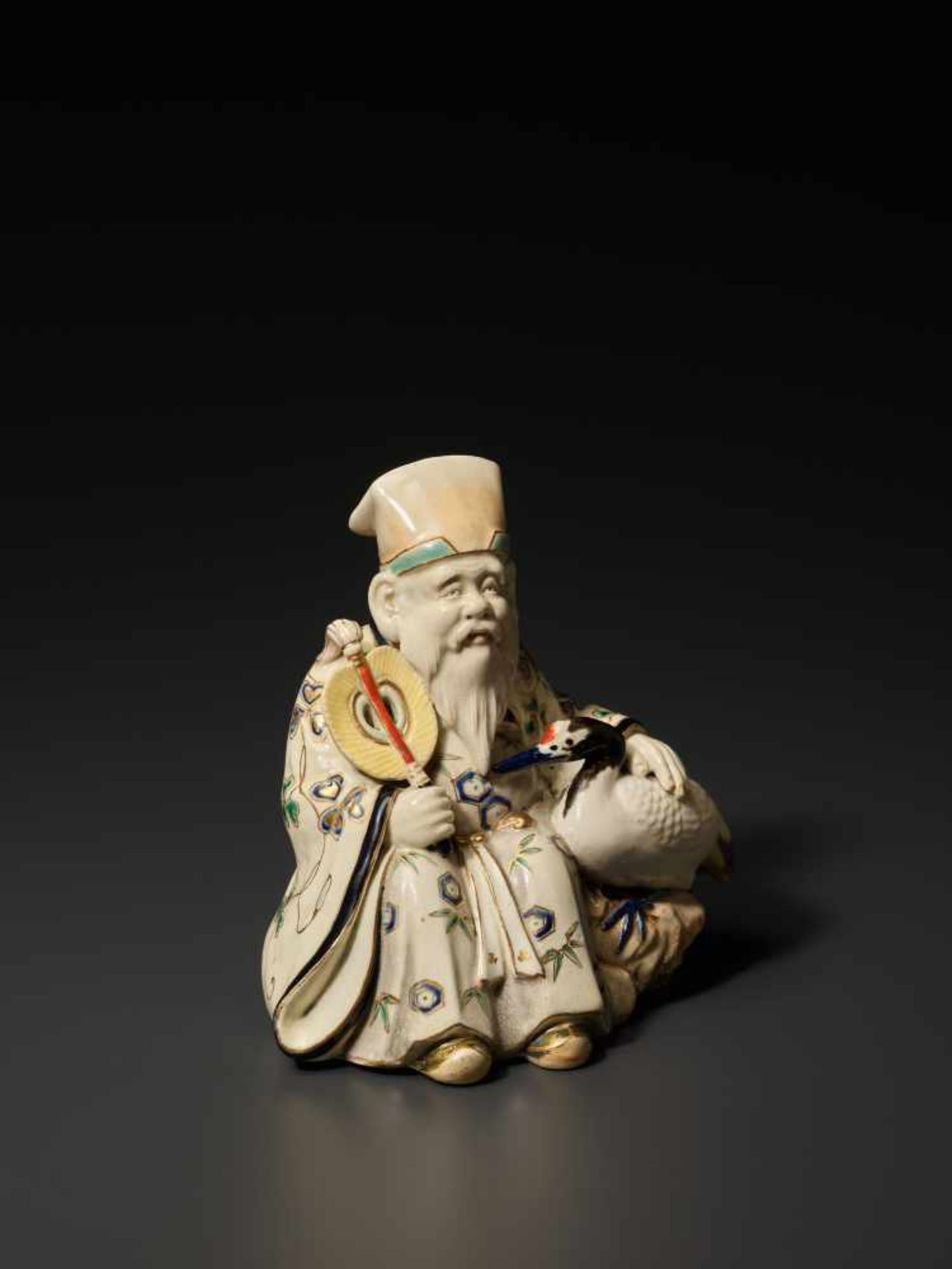 A SATSUMA OKIMONO FIGURE OF FUKUROKUJU WITH CRANESatsuma ceramicJapan, late 19th century, Meiji - Image 3 of 10