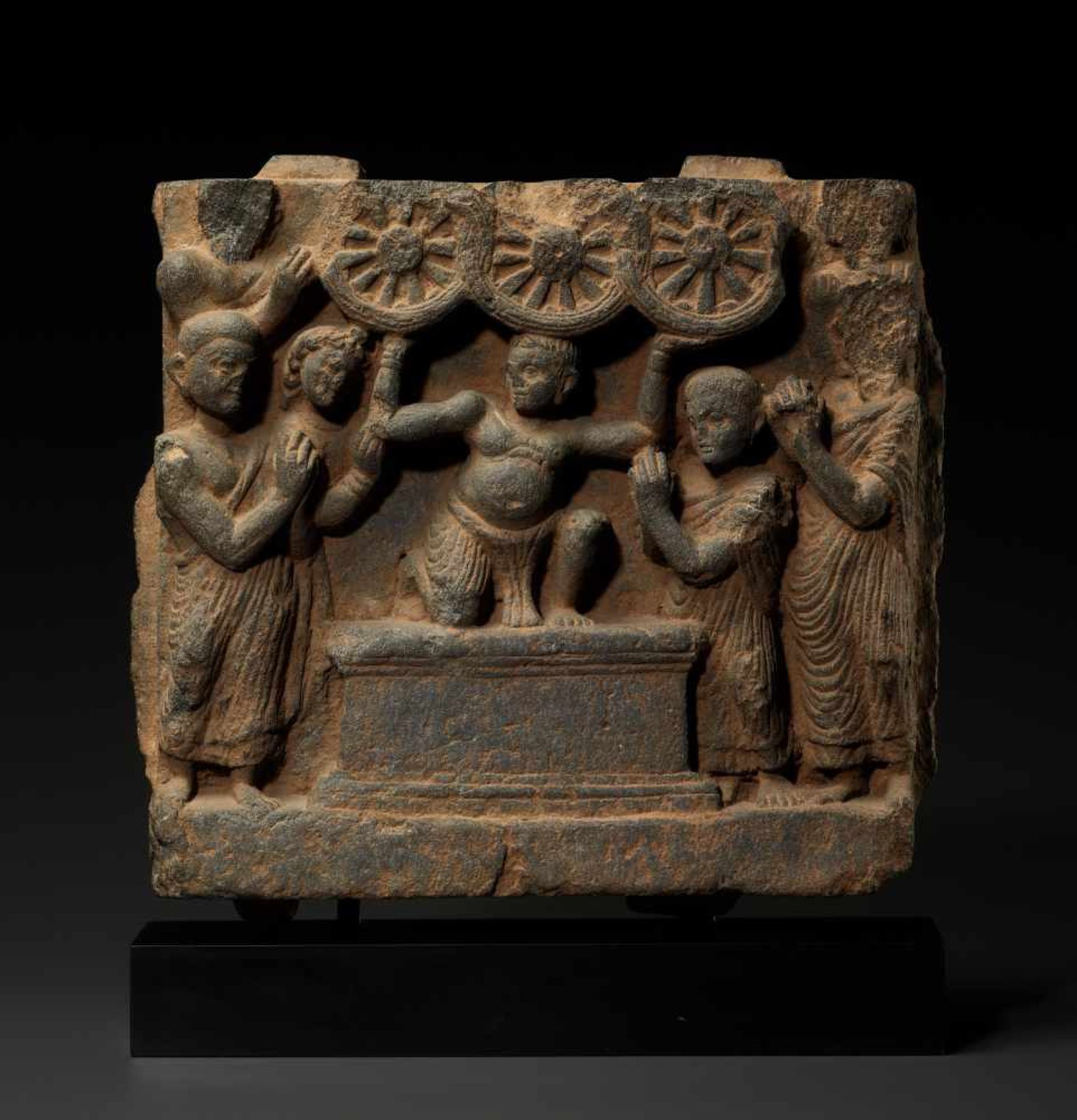 A GANDHARA SCHIST FRIEZE OF THE FIRST SERMON OF BUDDHA, 2nd – 3rd CENTURYGrey schist, with modern