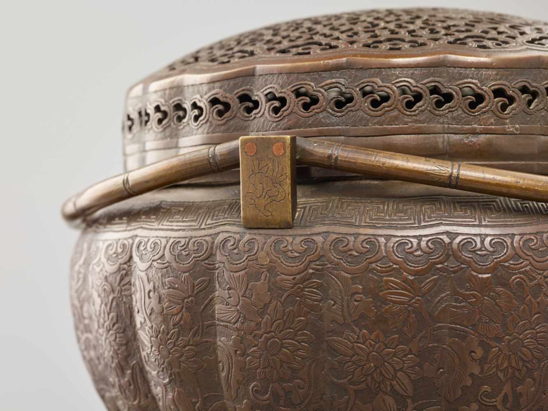 A COPPER HAND-WARMER WITH RETICULATED COVER, QING DYNASTYThe metal with an even reddish-brown - Image 10 of 15