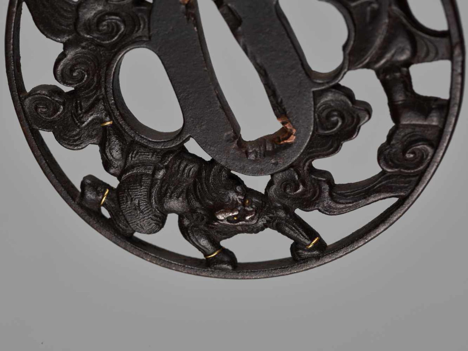 AN IRON TSUBA DEPICTING SHOKI AND ONIIronJapan, 19th century, Edo period (1615-1868)The patinated - Image 4 of 4