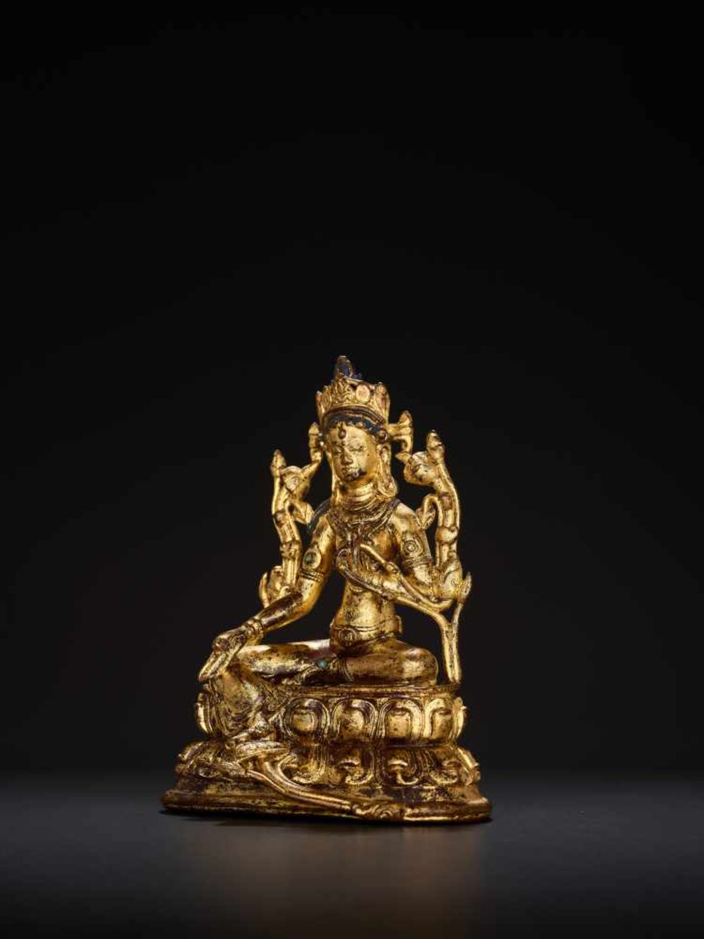 A TURQUOISE INLAID GILT BRONZE FIGURE OF A GREEN TARA, TIBET, 17th – 18th CENTURYCast and chased - Image 2 of 7