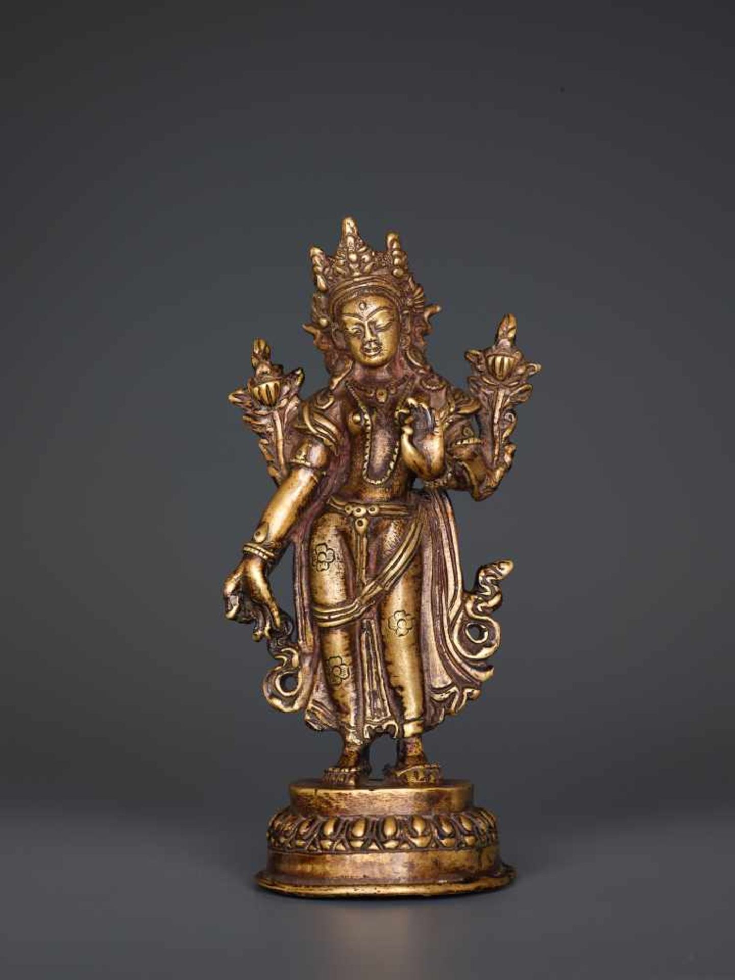 A BRONZE FIGURE OF TARA STANDING IN TRIBHANGA, TIBET, 19th CENTURY Cast and chased bronze, sealed