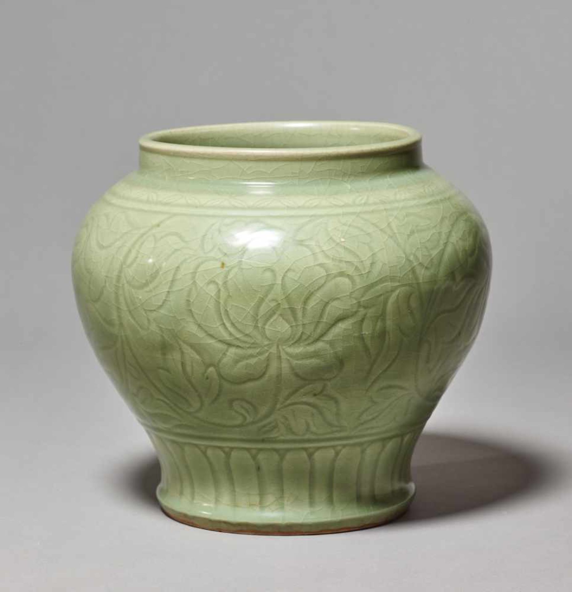 A LONGQUAN CARVED BALUSTER ‘LOTUS’ JAR, MING DYNASTYThe large and massively potted jar entirely