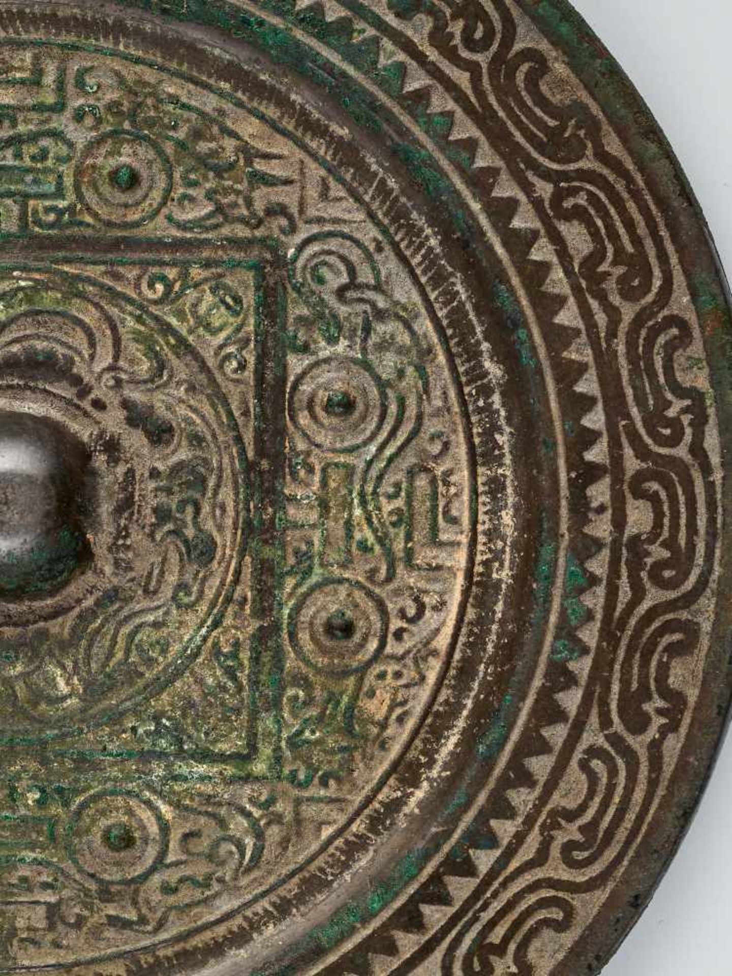 A LARGE INSCRIBED 'TLV' BRONZE MIRROR, HAN DYNASTYCast bronze with high relief, the patina with - Image 4 of 6