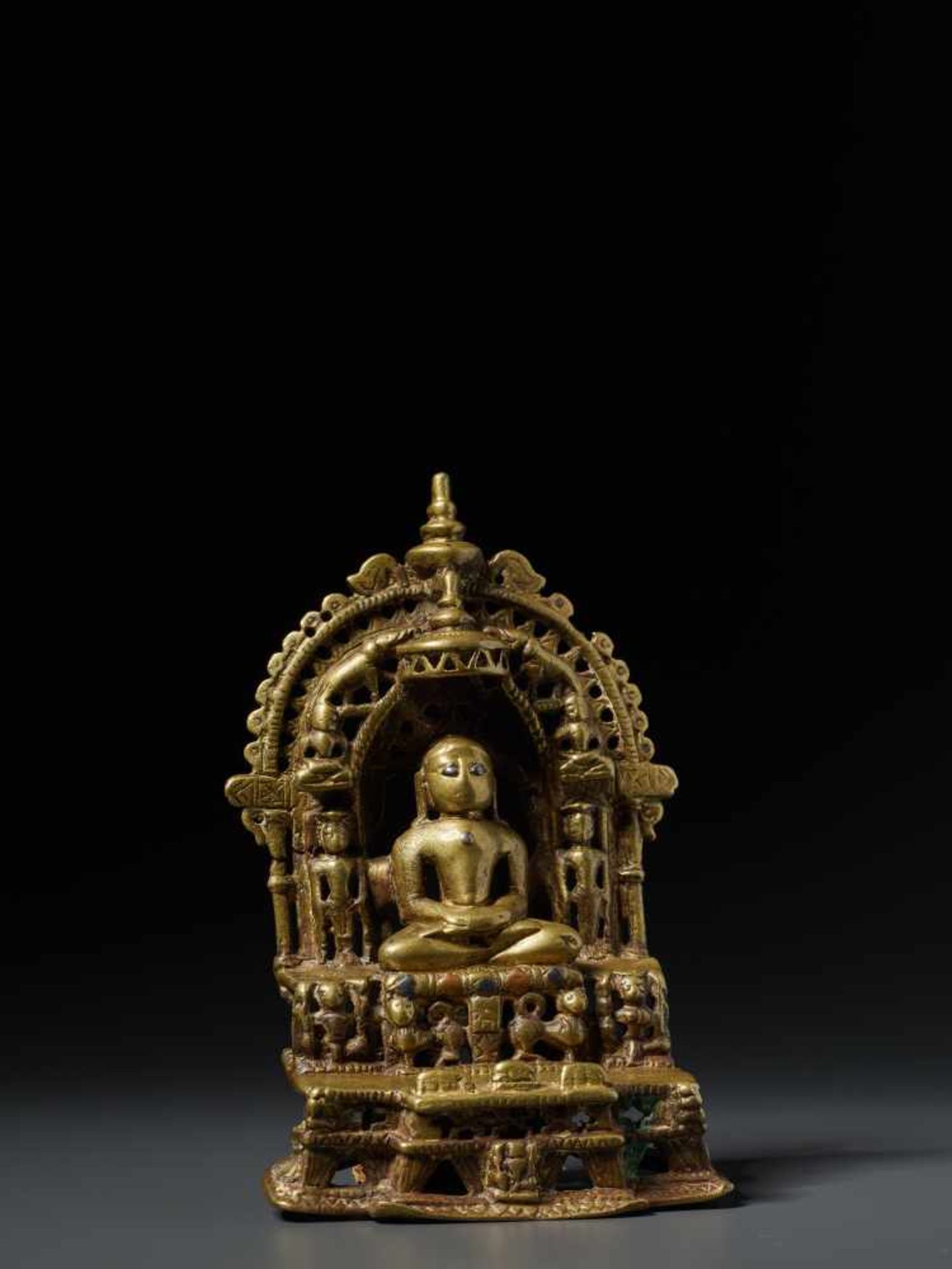 A SILVER AND COPPER INLAID JAIN BRASS SHRINE WITH MAHAVIRA, 15th – 16th CENTURY Brass with copper - Image 3 of 8