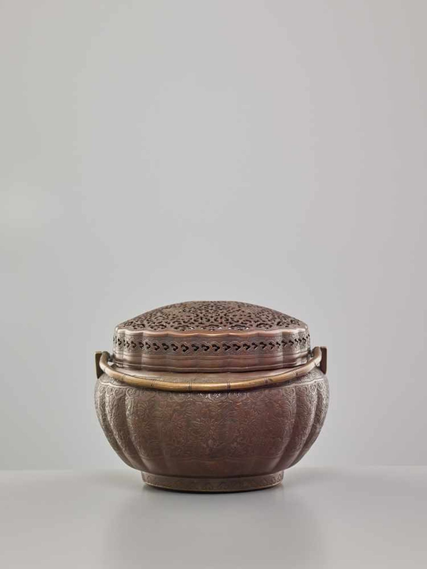 A COPPER HAND-WARMER WITH RETICULATED COVER, QING DYNASTYThe metal with an even reddish-brown - Image 4 of 15