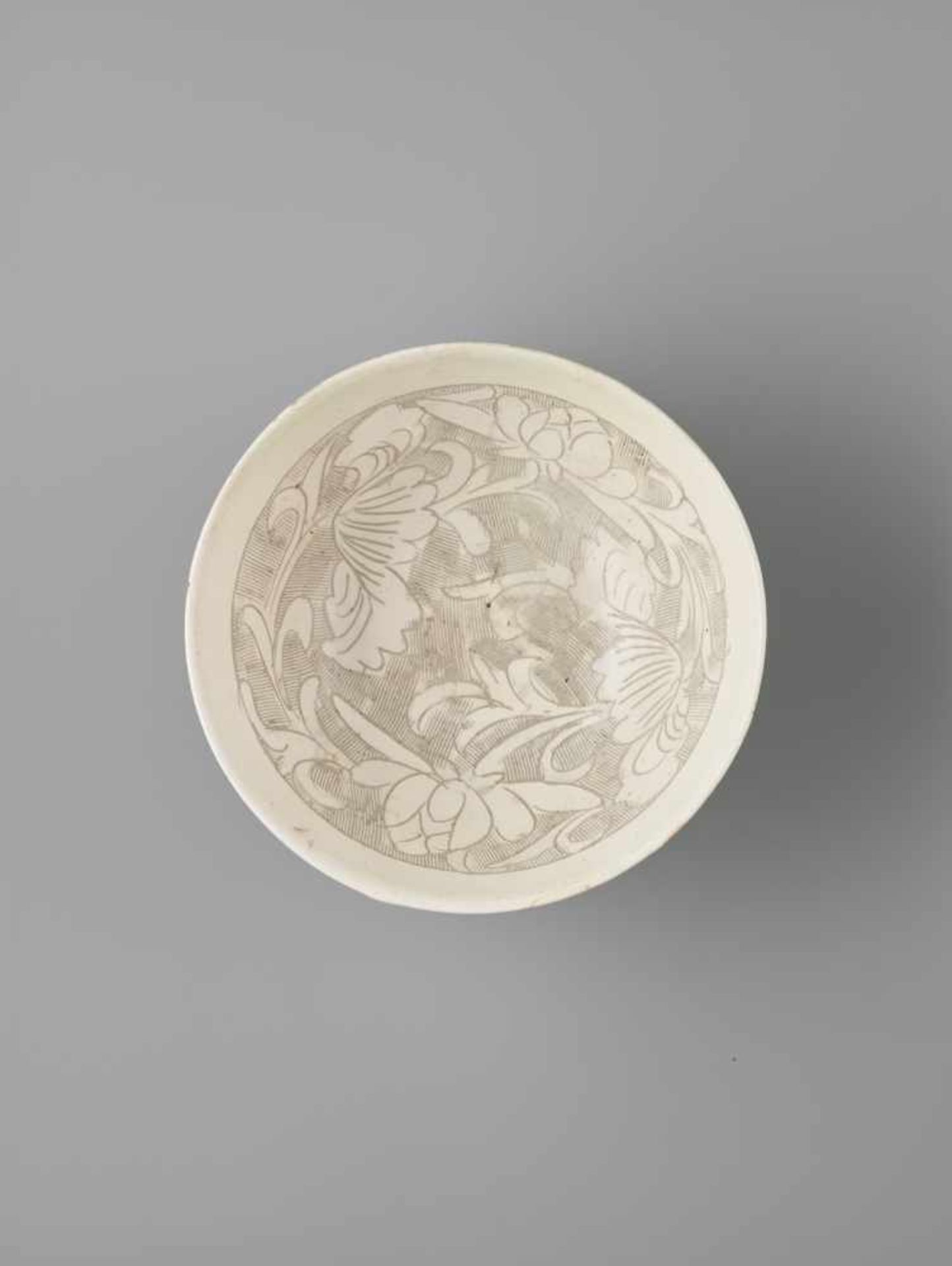 A CIZHOU ‘LOTUS AND CHRYSANTHEMUM’ SGRAFFIATO BOWL, 13TH – 14TH CENTURY PUBLISHED: Song Ceramics,