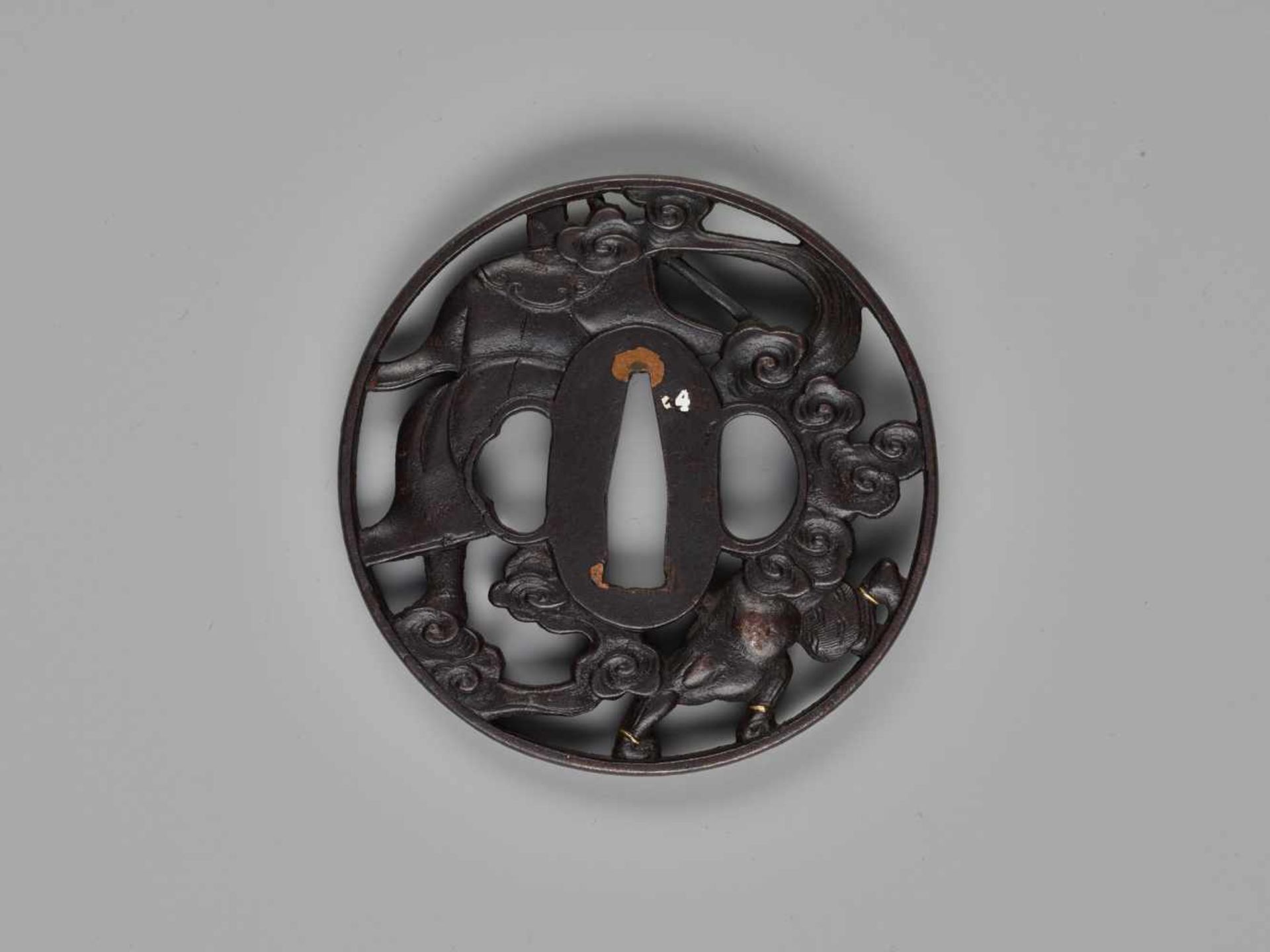 AN IRON TSUBA DEPICTING SHOKI AND ONIIronJapan, 19th century, Edo period (1615-1868)The patinated - Image 2 of 4