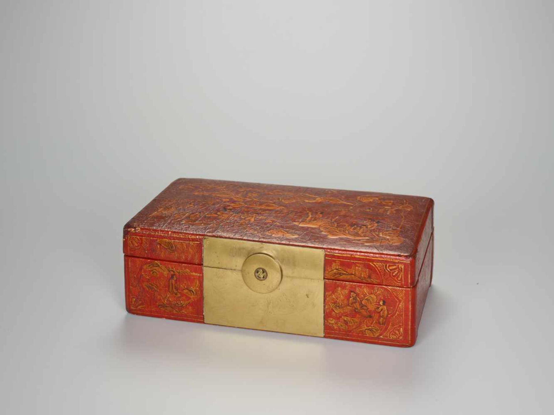 A BRASS FITTED PIG SKIN LACQUER BOX WITH VILLAGE SCENES, QING DYNASTY Pig skin on wooden body,