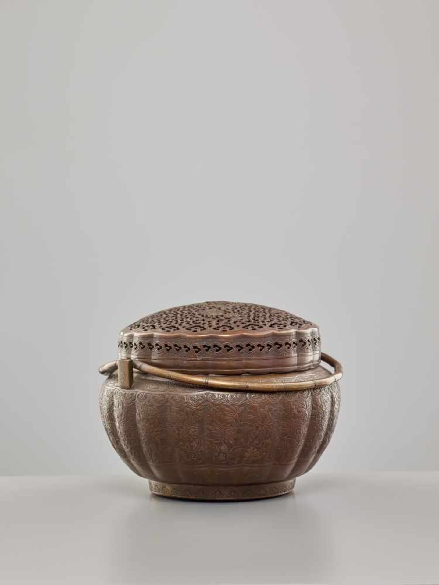 A COPPER HAND-WARMER WITH RETICULATED COVER, QING DYNASTYThe metal with an even reddish-brown - Image 7 of 15