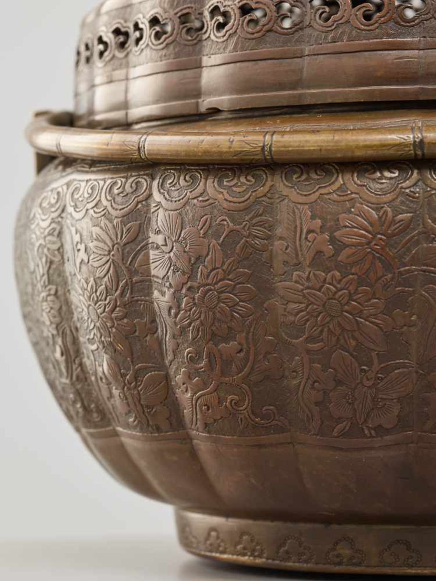 A COPPER HAND-WARMER WITH RETICULATED COVER, QING DYNASTYThe metal with an even reddish-brown - Image 11 of 15