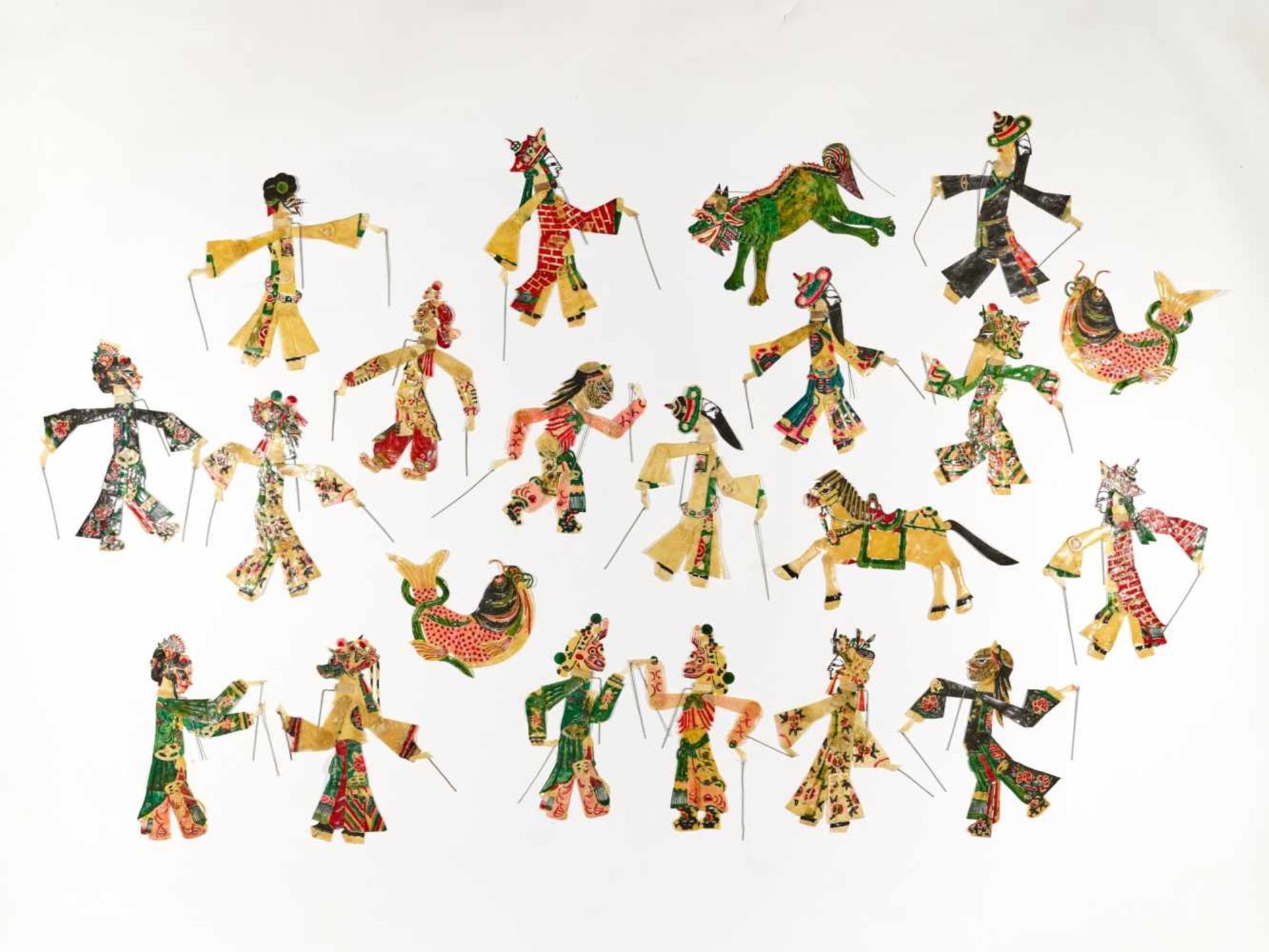 A SET WITH 21 HAND PAINTED CHINESE SHADOW PUPPETS, 1930sHand painted hide, small metal rodsChina,