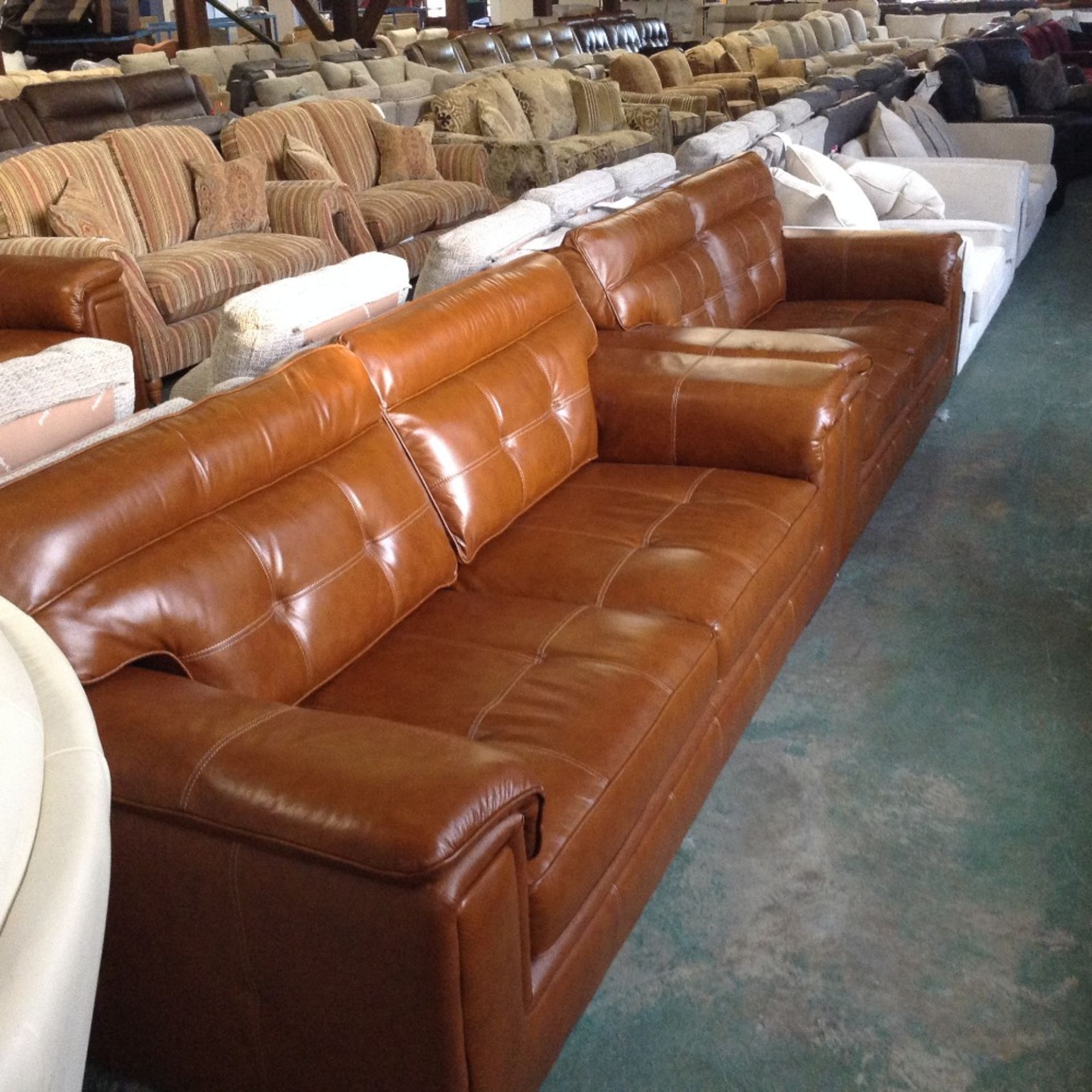 BROWN LEATHER WITH WHITE STITCHING 3 SEATER SOFA A