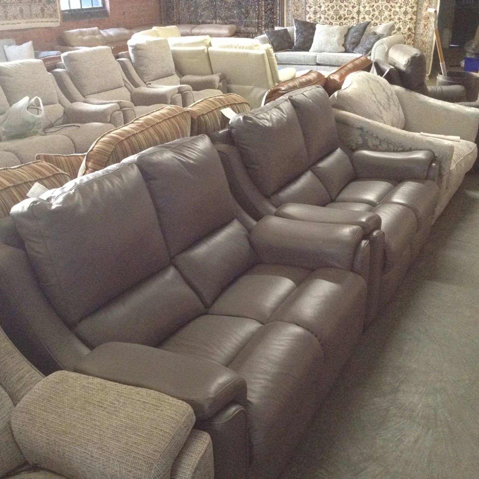 2 X GREY LEATHER TWO SEATER SOFAS (TROO1055-WOO065