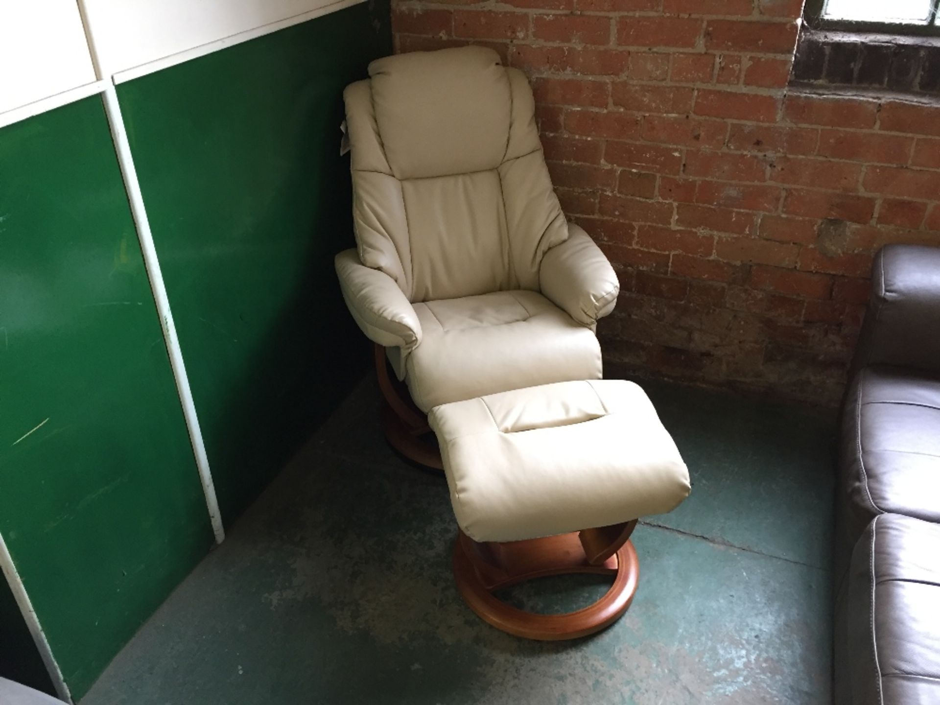 CREAM LEATHER RECLINING CHAIR AND FOOTSTOOL