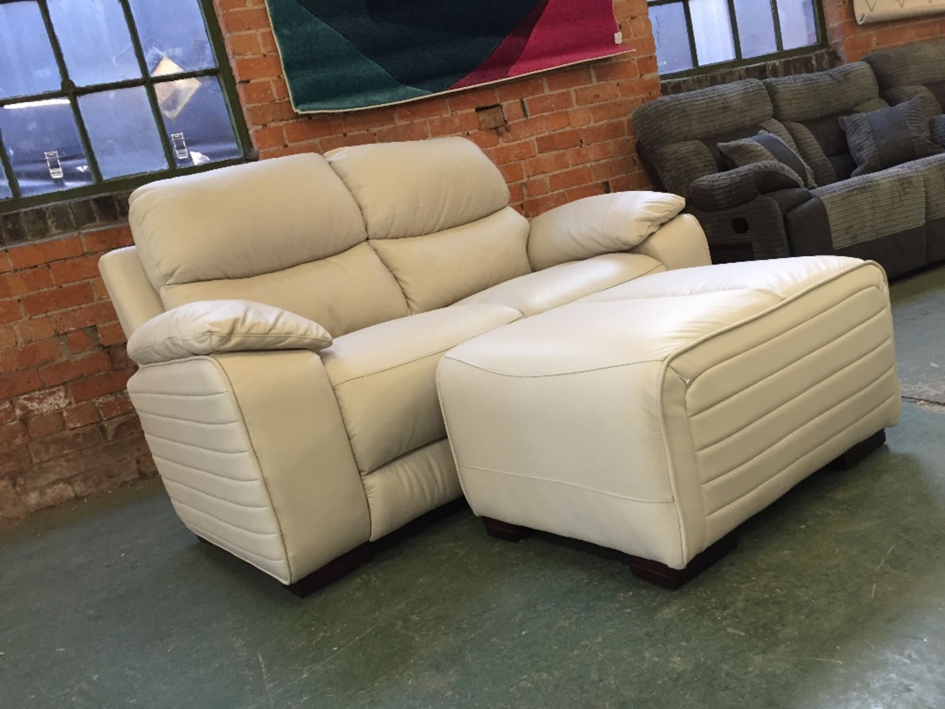 CREAM LEATHER 2 SEATER SOFA AND FOOTSTOOL (370-802