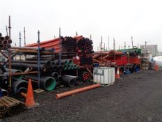 Quantity of miscellaneous various concrete rings and drainage pipe to middle section of yard as