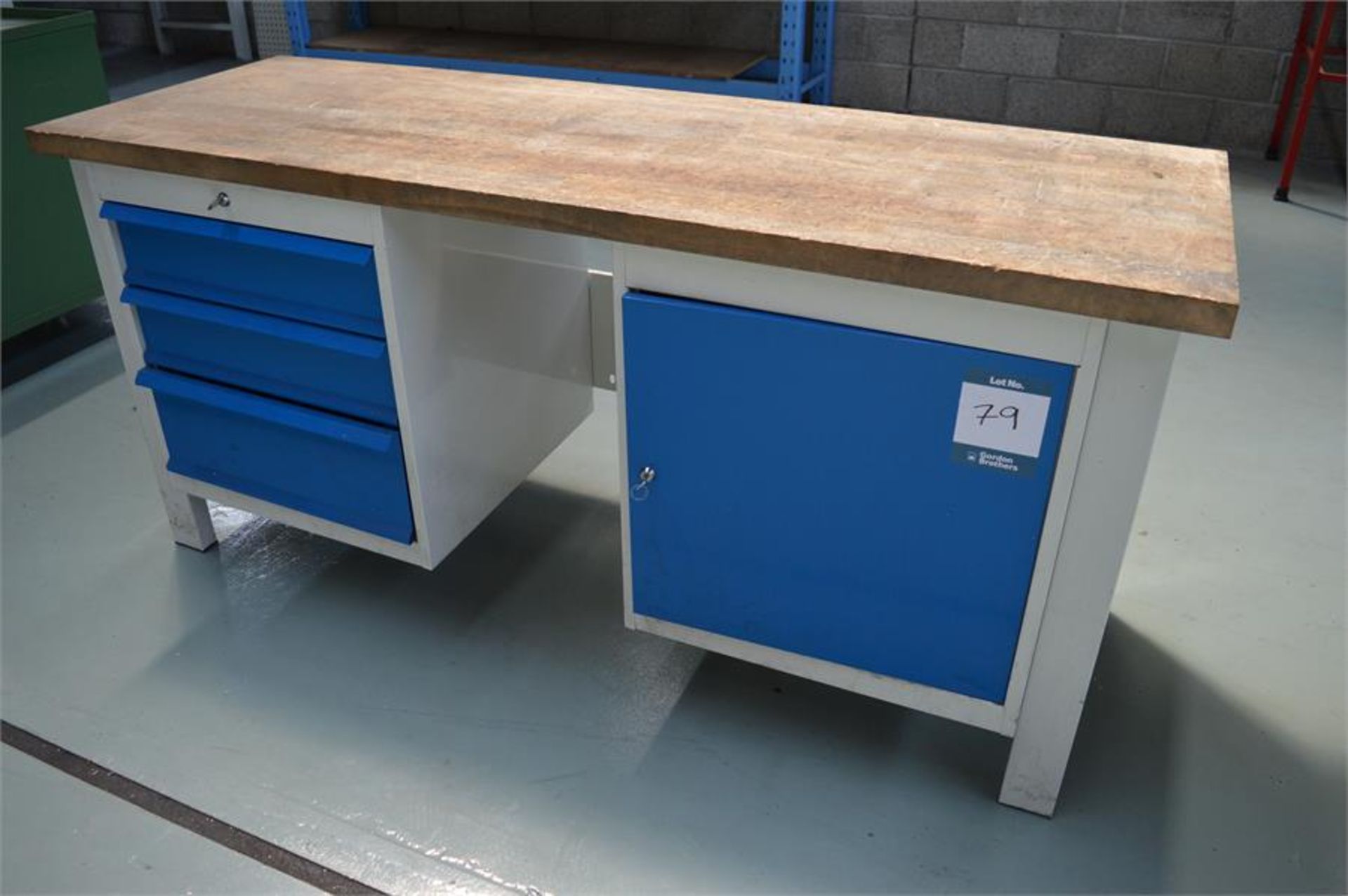 Steel framed, wooden topped workbench with 3 drawers and cupboard