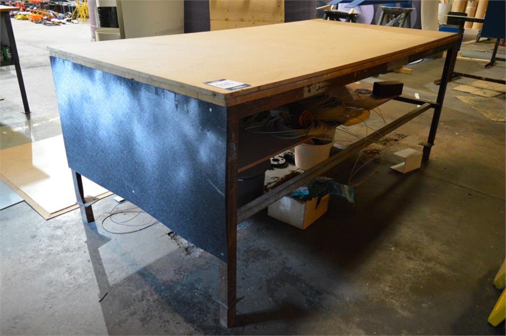 Steel framed wooden topped fabricated workbench, 2.44m x 1.22m x 1.01m (H), (contents not included)