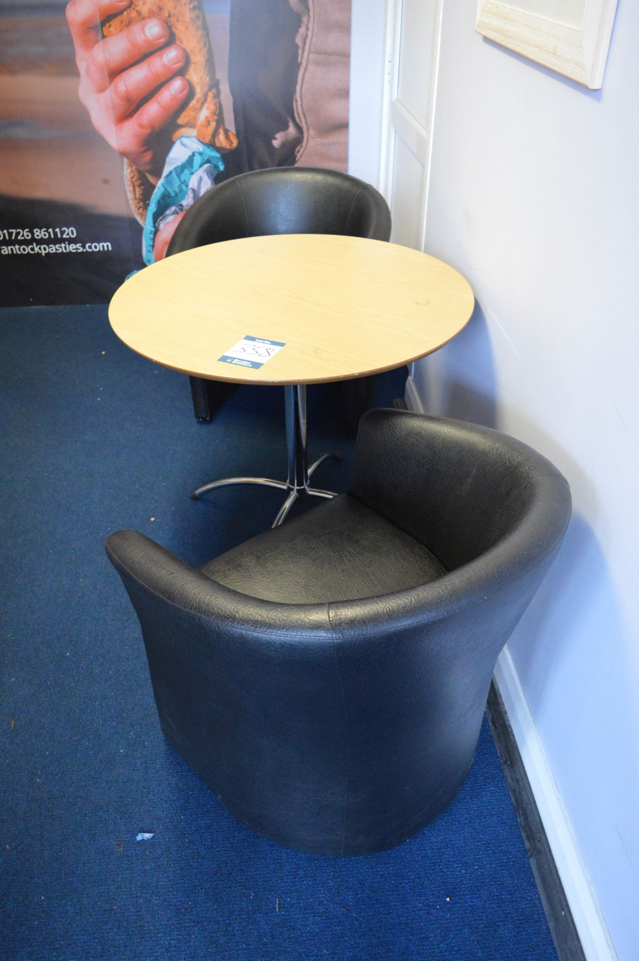 Circular table with 2 - tub chairs, side unit, coffee table, magazine stand, and tambour fronted