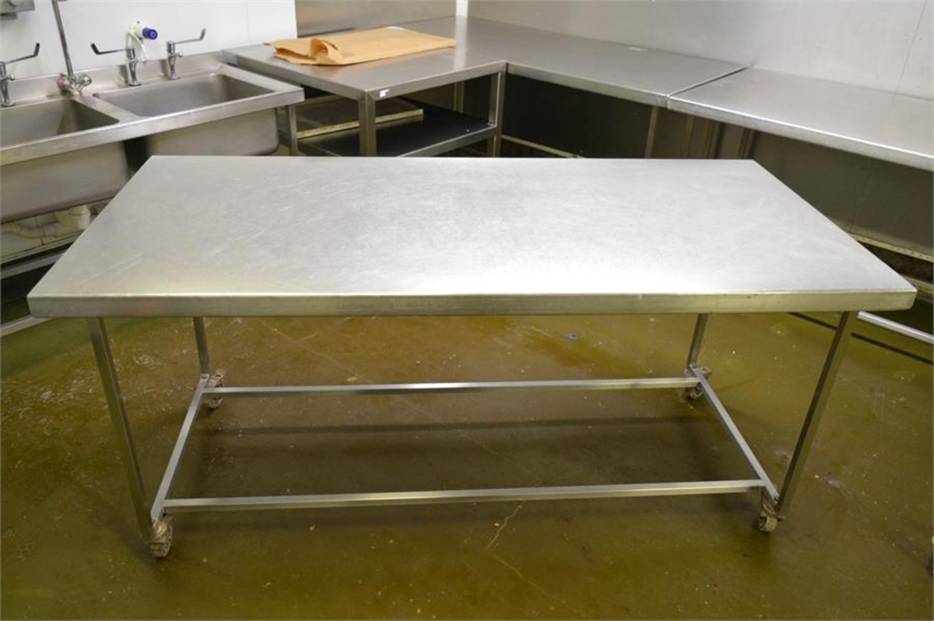 Stainless steel mobile prep table, 1.87m (w) x 0.87m (d) x 0.88m (h) with tin opener (Located at