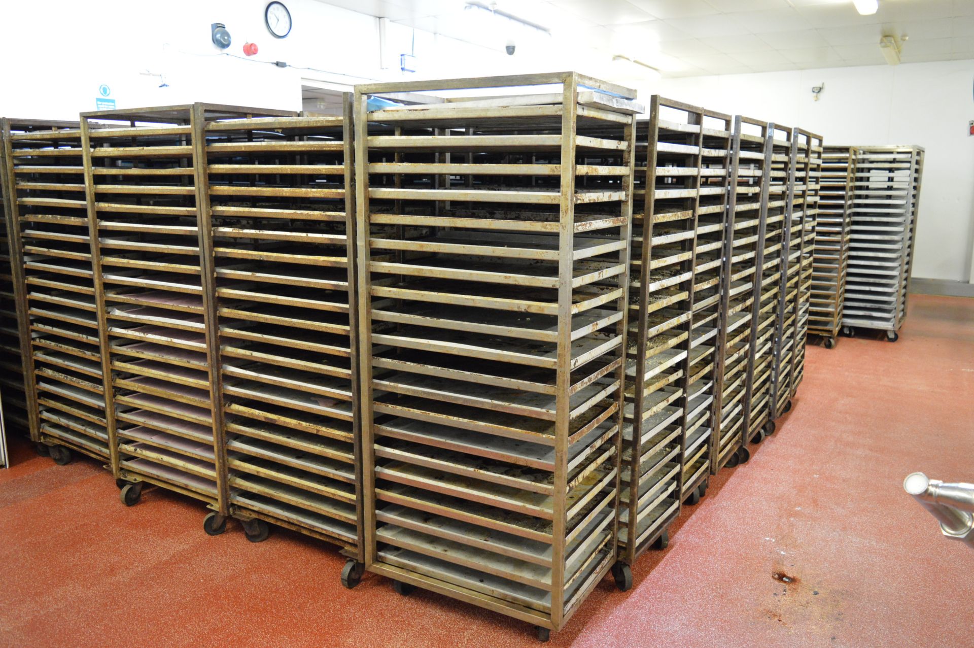 5 x stainless steel, mobile oven racks with trays (Located at Crantock Bakery, Newquay)