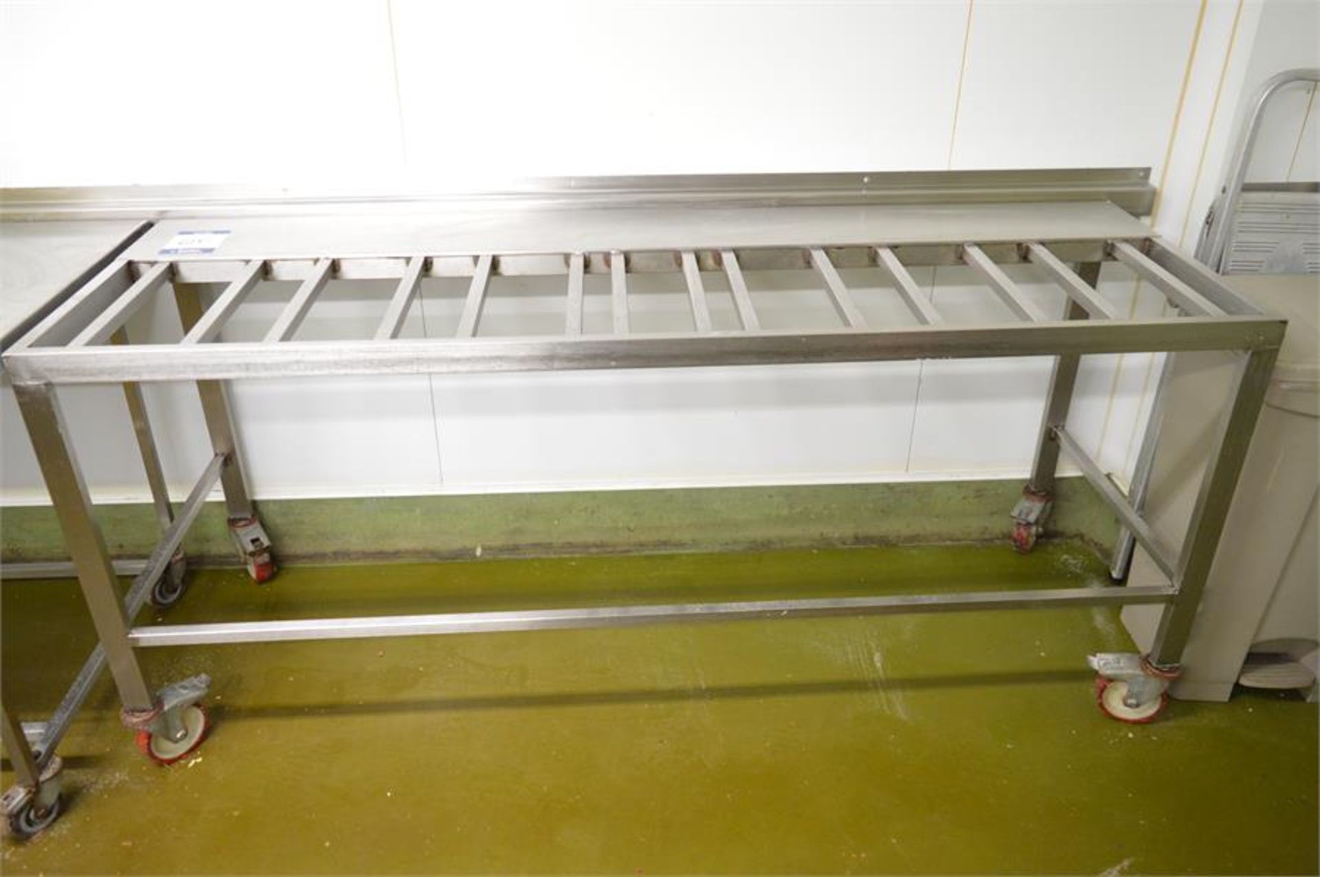 Stainless steel mobile tray table, 2m (w) x 0.66m (d) x 0.88m (h) (Located at Continental