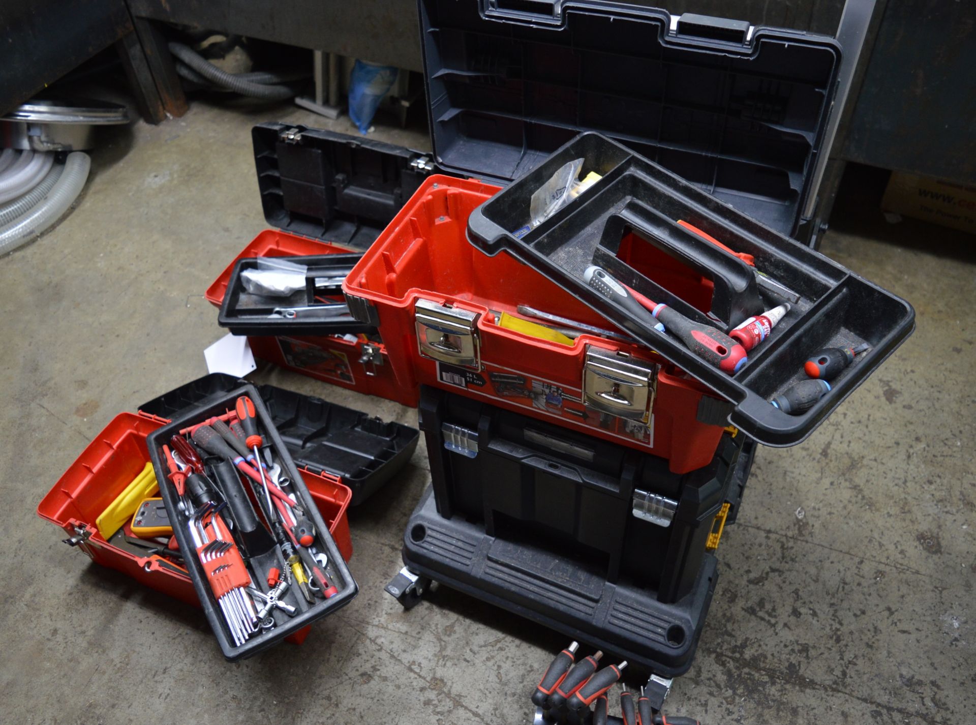 Three Facon 31L and 1 - DeWalt plastic tool boxes with contents of small hand tools (Located at