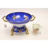 A Noritake comport and stand, blue ground and decorated with painted butterflies,