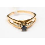 A 14ct gold sapphire and diamond ring,