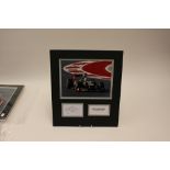 Formula 1 Memorabilia: A signed Kimi Raikkonen action photograph,