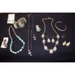 A collection of silver and turquoise jewellery to include a vintage sterling silver and three stone