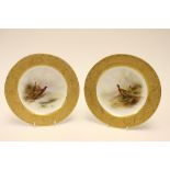James Stinton for Royal Worcester, a pair of cabinet plated, painted with pheasants,