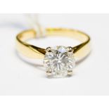 A diamond solitaire 18ct gold ring, the round brilliant cut diamond weighing approximately 1.