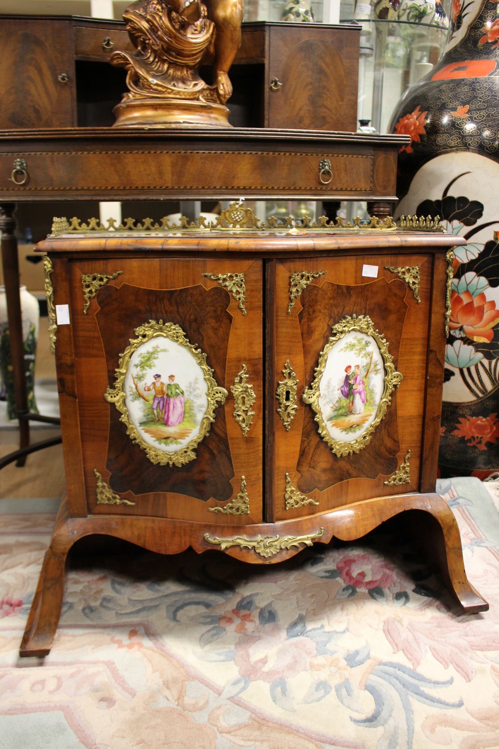 A French walnut veneered cabinet top, probably 19th Century, the top with a brass gallery,